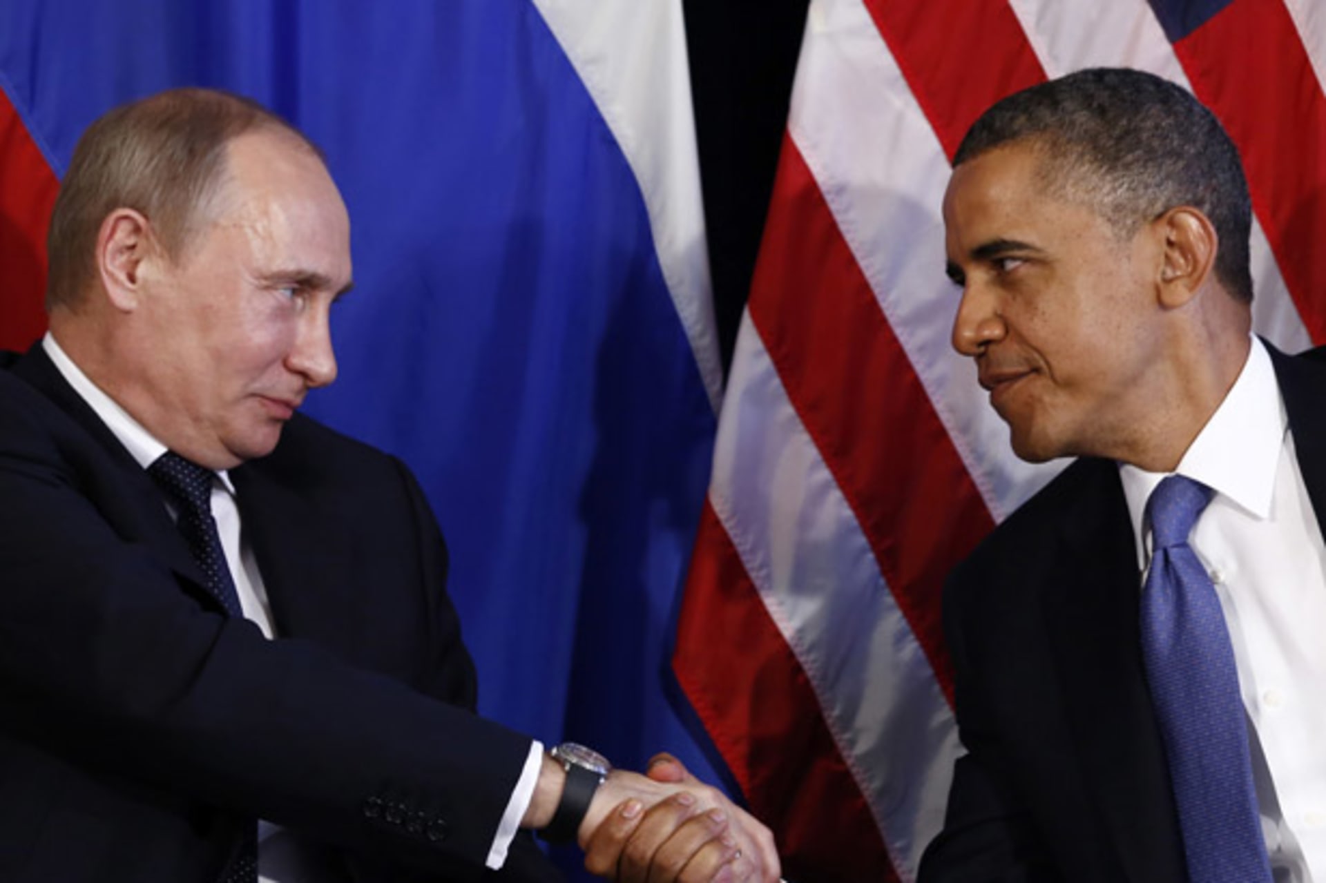 <p>Russian president Vladimir Putin shakes hands with U.S. president Barack Obama during the G20 summit in June 2012 (Jason Reed/Courtesy Reuters).</p>