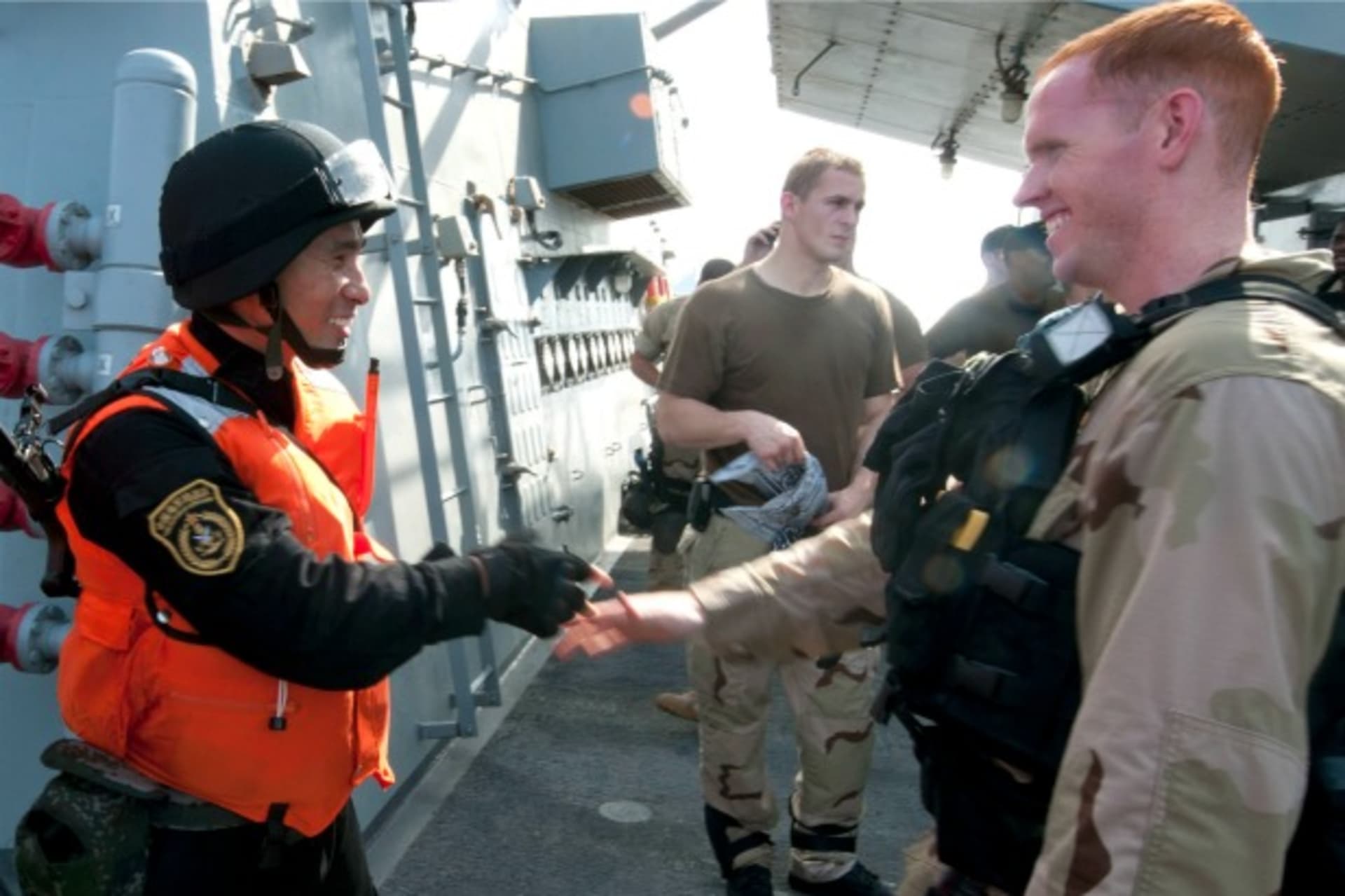 <p>A member of the visit, board, search and seizure (VBSS) team aboard the guided-missile destroyer USS Winston S. Churchill (R) …cise in the Gulf of Aden, September 17, 2012. (U.S. Navy/Mass Communication Specialist 2nd Class Aaron Chase/Courtesy Reuters)</p>
