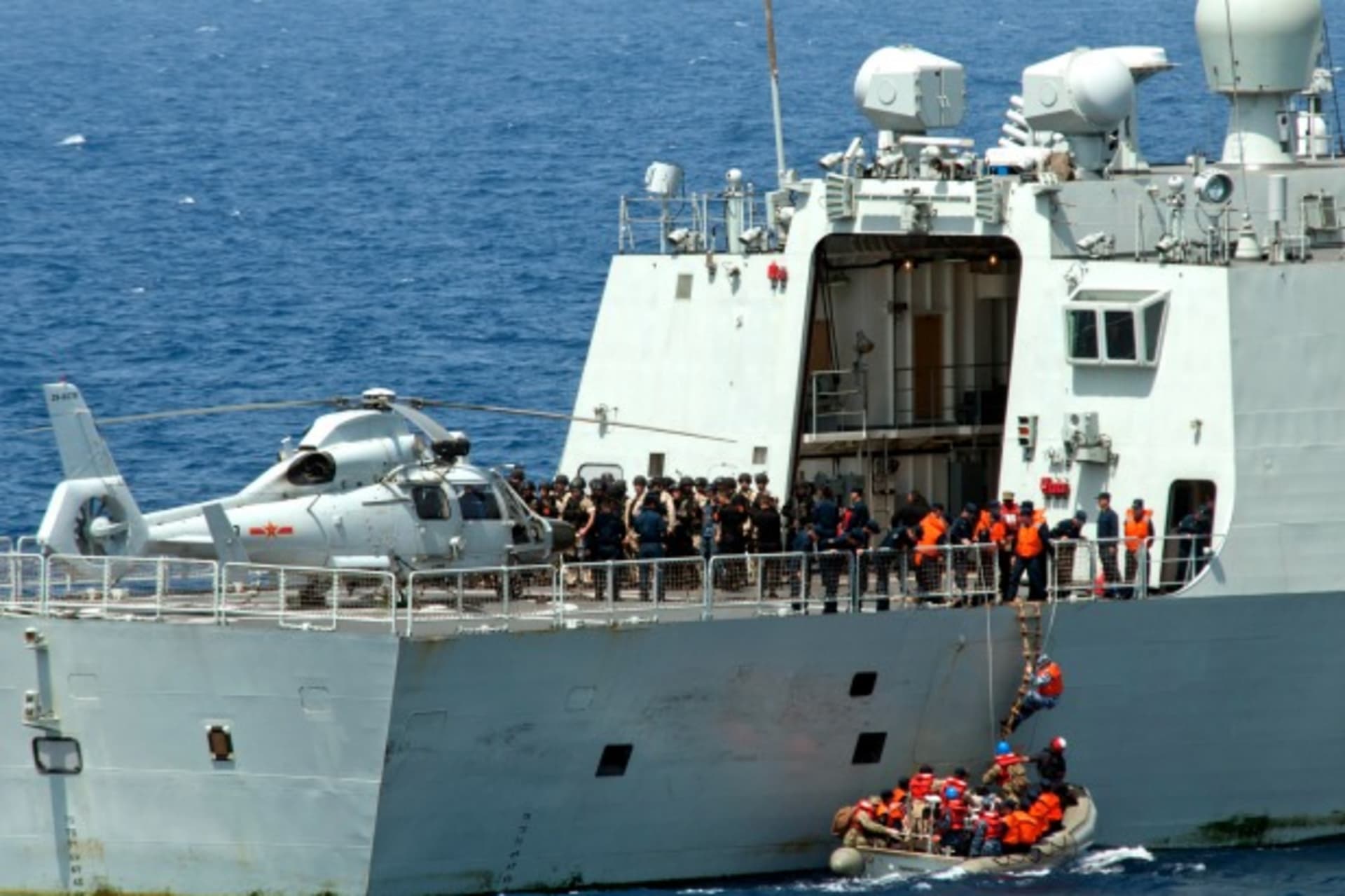 <p>Sailors from the guided-missile destroyer USS Winston S. Churchill board the Chinese People’s Liberation Army (Navy) frigate Y…e in the Gulf of Aden on September 17, 2012. (U.S. Navy/Mass Communication Specialist 2nd Class Aaron Chase/Courtesy Reuters).</p>
