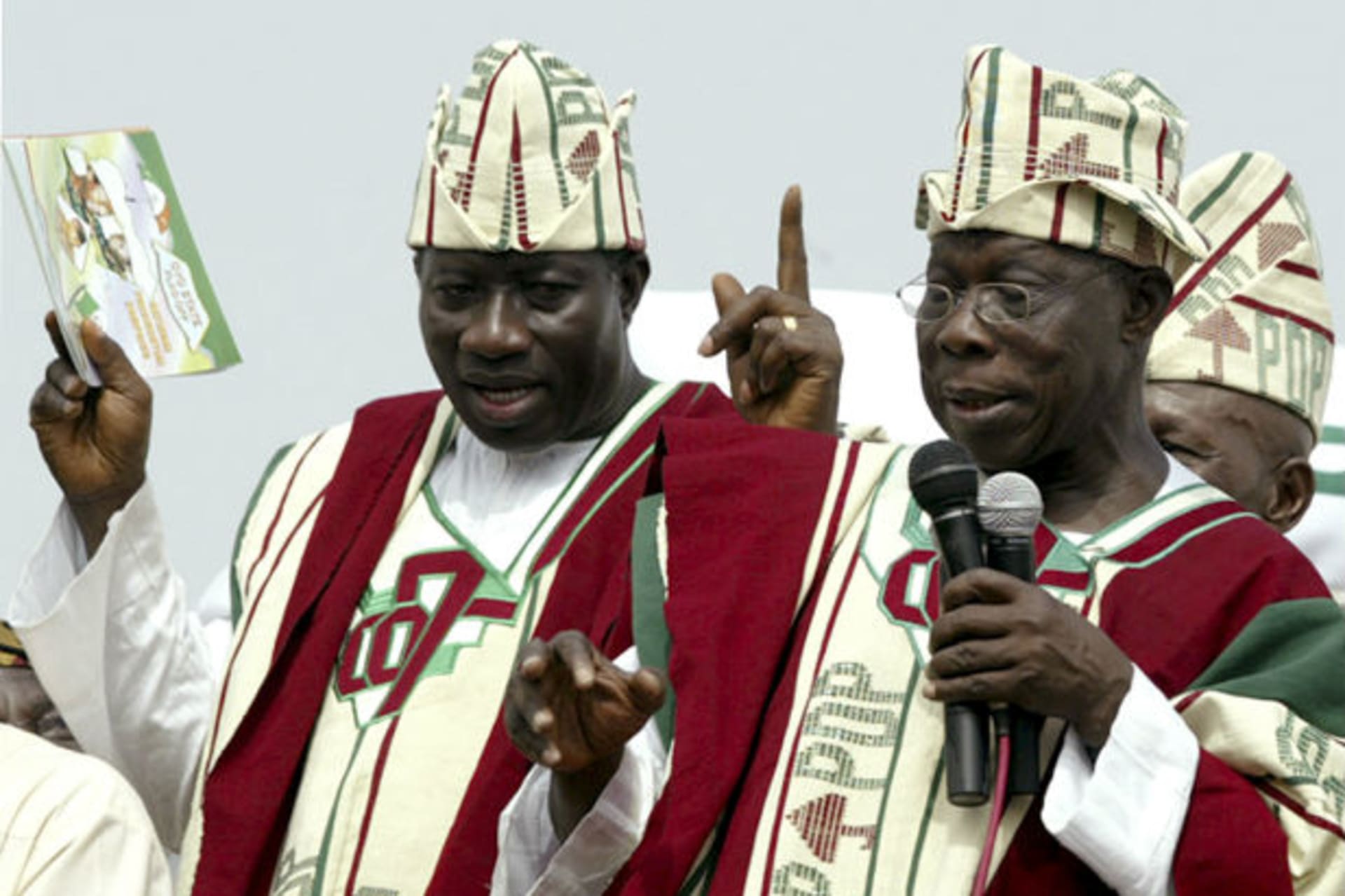 Nigeria's President Olusegun Obasanjo (R) and the People's Democratic Party's (PDP) vice presidential candidate Goodluck Jonathan (left) speaks during a PDP presidential campaign rally in Ibadan March 8, 2007.