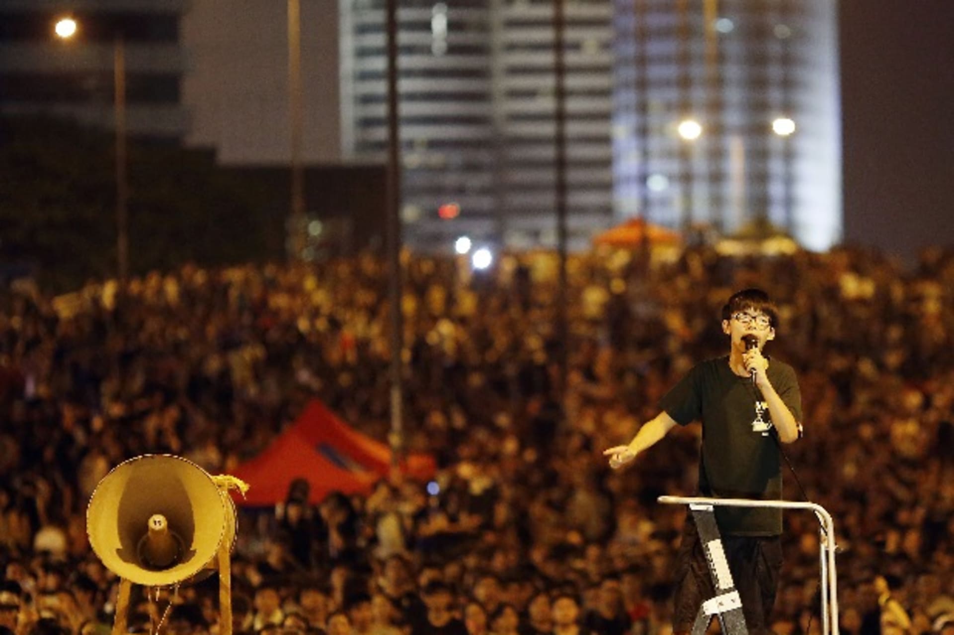 <p>Joshua Wong, leader of the student movement, delivers a speech as protesters block the main street to the financial Central di…s, and students threatened to ramp up demonstrations if the city’s pro-Beijing leader did not step down. REUTERS/Carlos Barria</p>
