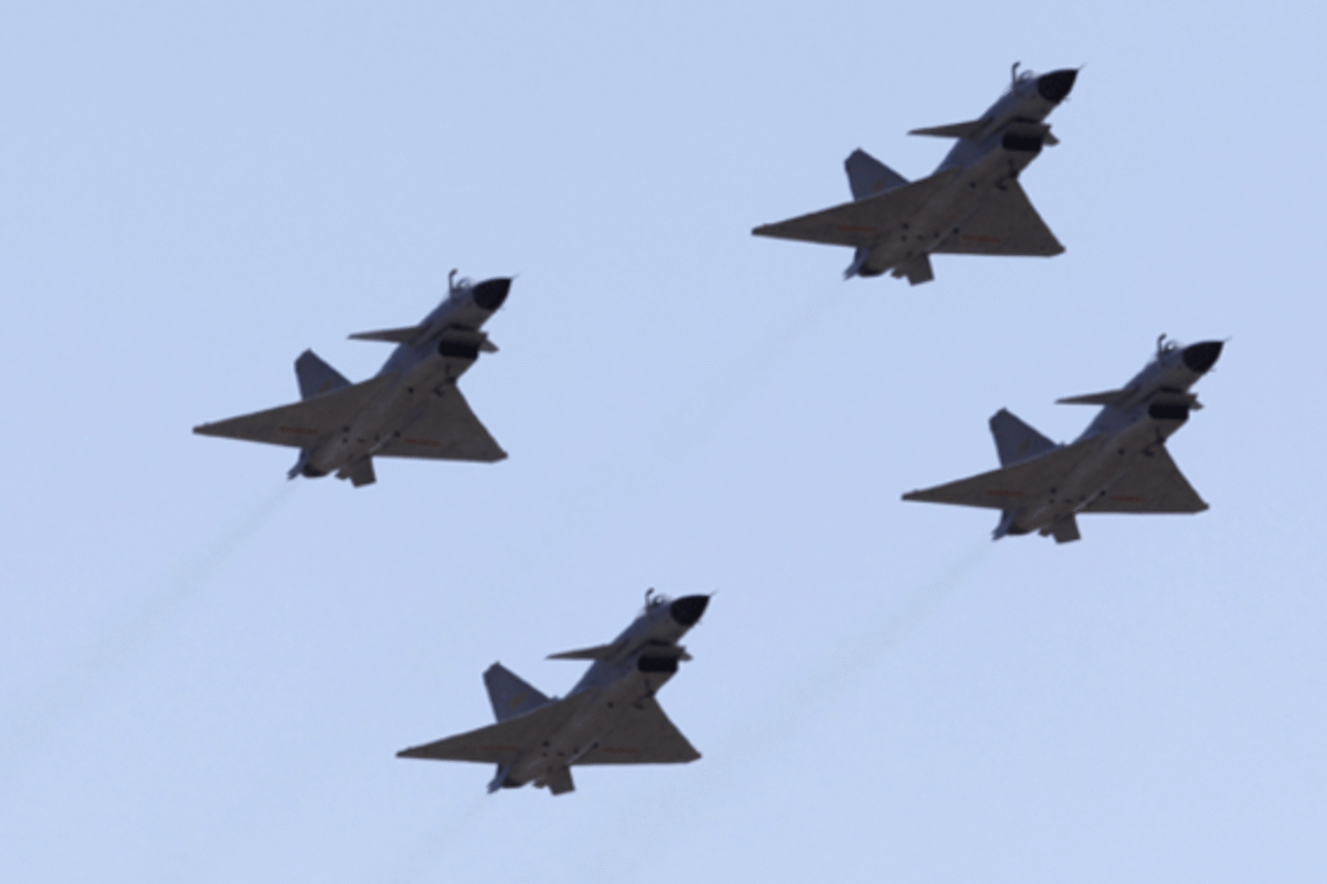 <p>Chinese Jian-10 fighter jets of China Air Force fly at Yangcun Air Force base. (Petar Kujundzic/courtesy Reuters)</p>
