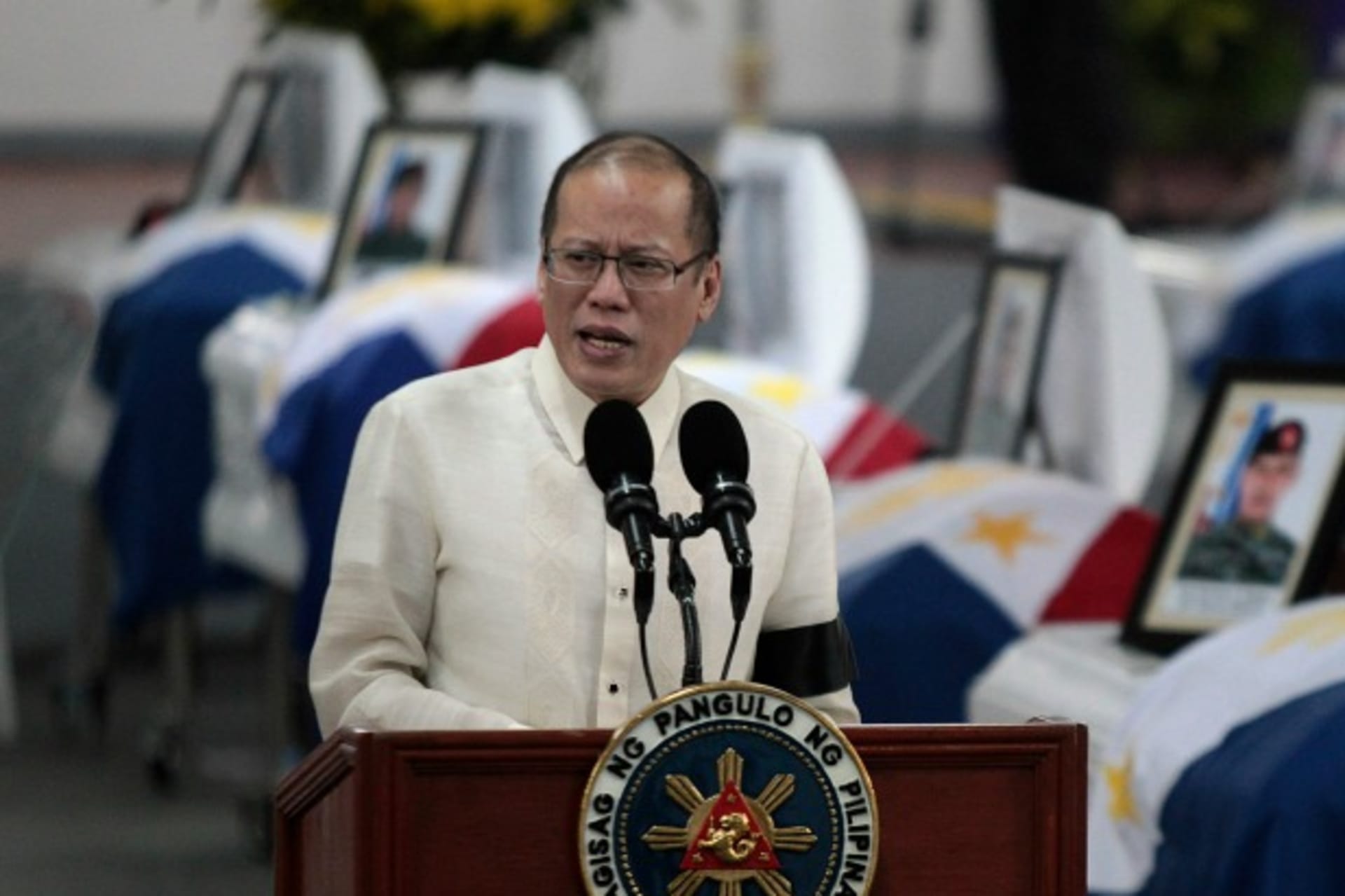 <p>Philippine President Benigno Aquino delivers a speech in front of the caskets of the slain members of the Special Action Force…uge with Moro Islamic Liberation Front (MILF) fighters. REUTERS/Romeo Ranoco (PHILIPPINES – Tags: POLITICS CRIME LAW MILITARY)</p>
