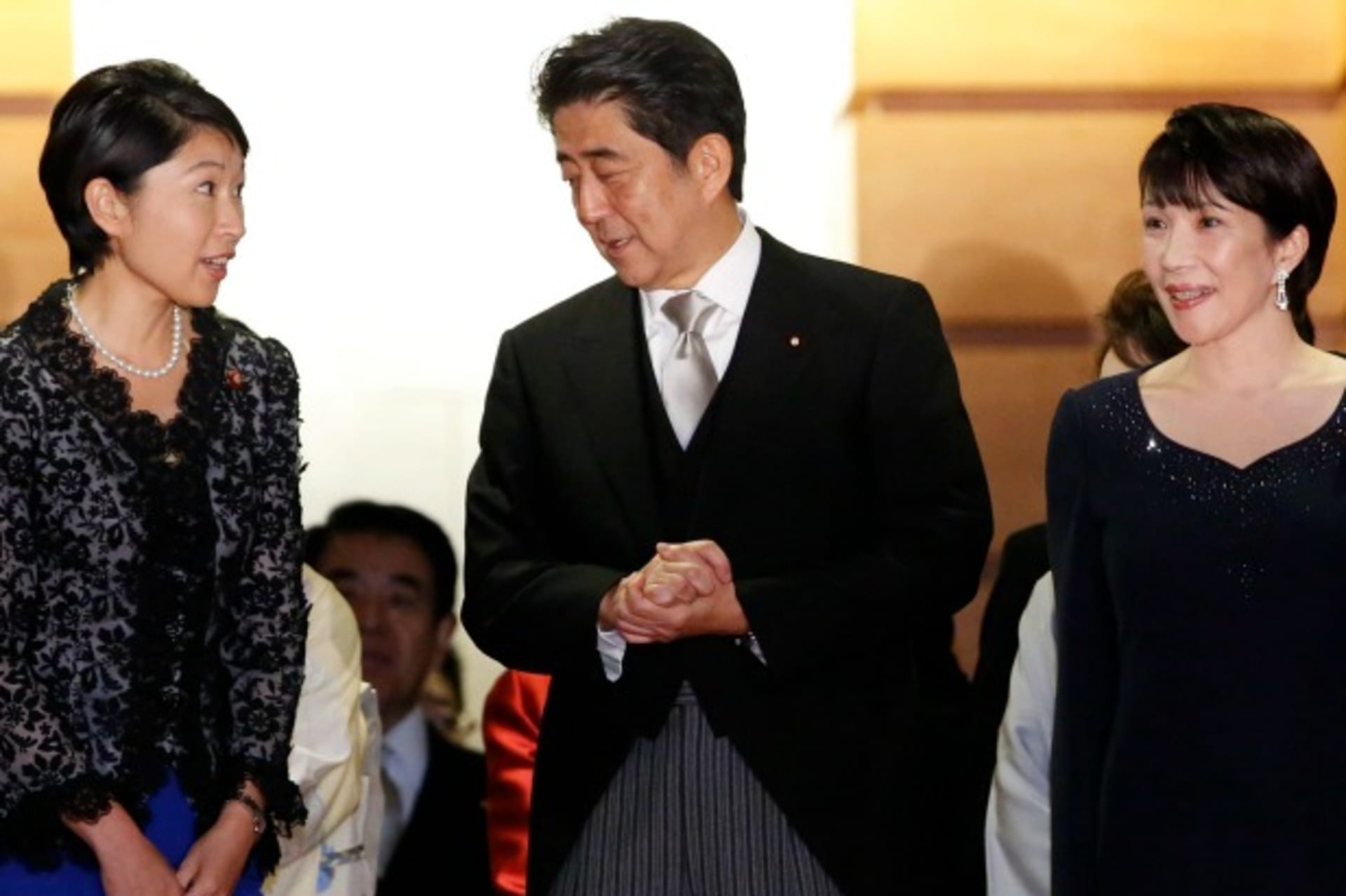 <p>Japan’s Prime Minister Shinzo Abe (C) talks with Economy, Trade and Industry Minister Yuko Obuchi (L) and Internal Affairs and…chi as they prepare for a photo session at his official residence in Tokyo on September 3, 2014. (Toru Hanai/Courtesy Reuters)</p>
