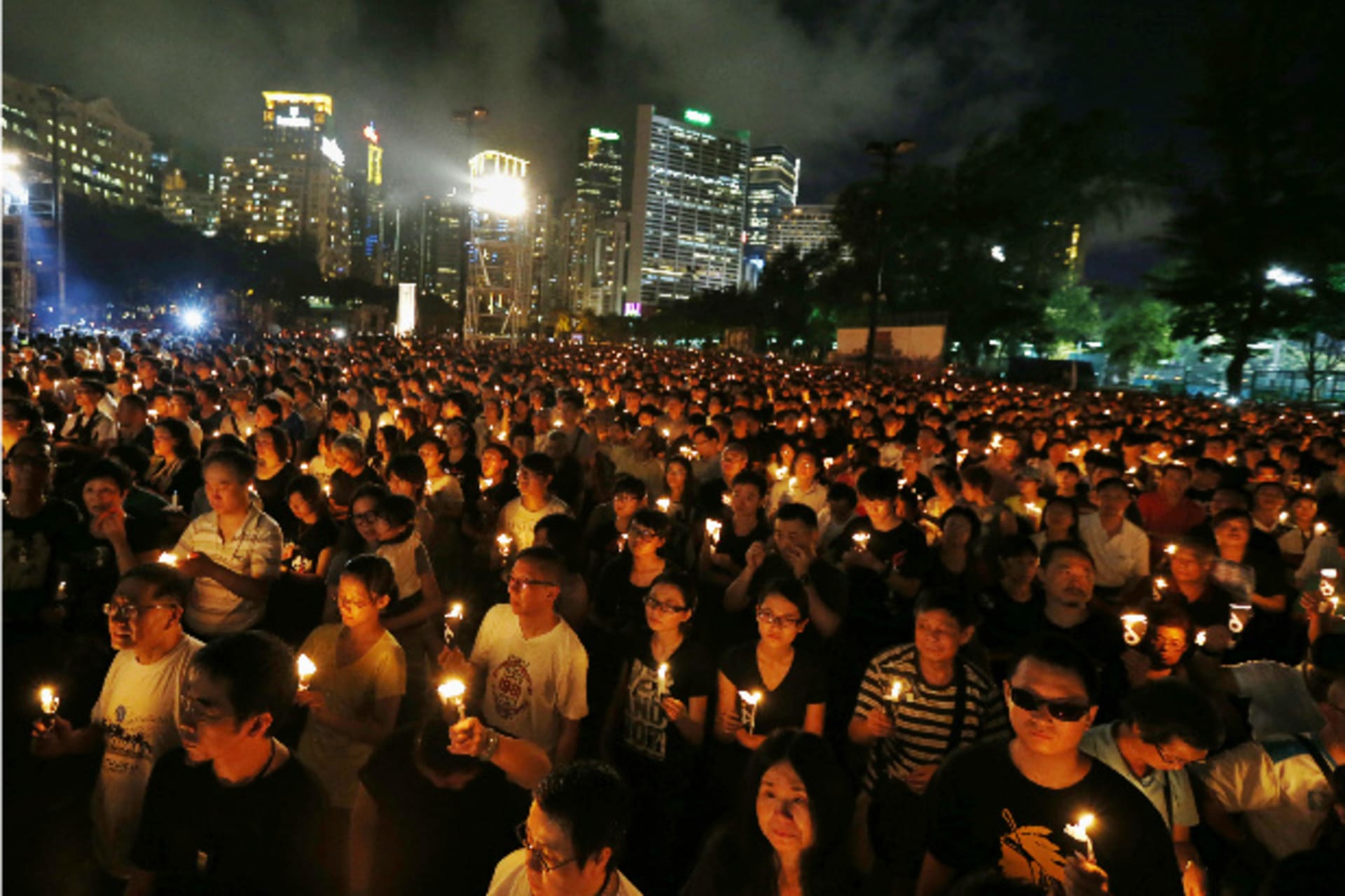<p>Tens of thousands of people take part in a candlelight vigil at Hong Kong’s Victoria Park on June 4, 2014, to mark the 25th an…y of the military crackdown on the pro-democracy movement at Beijing’s Tiananmen Square in 1989 (Bobby Yip/Courtesy: Reuters).</p>

