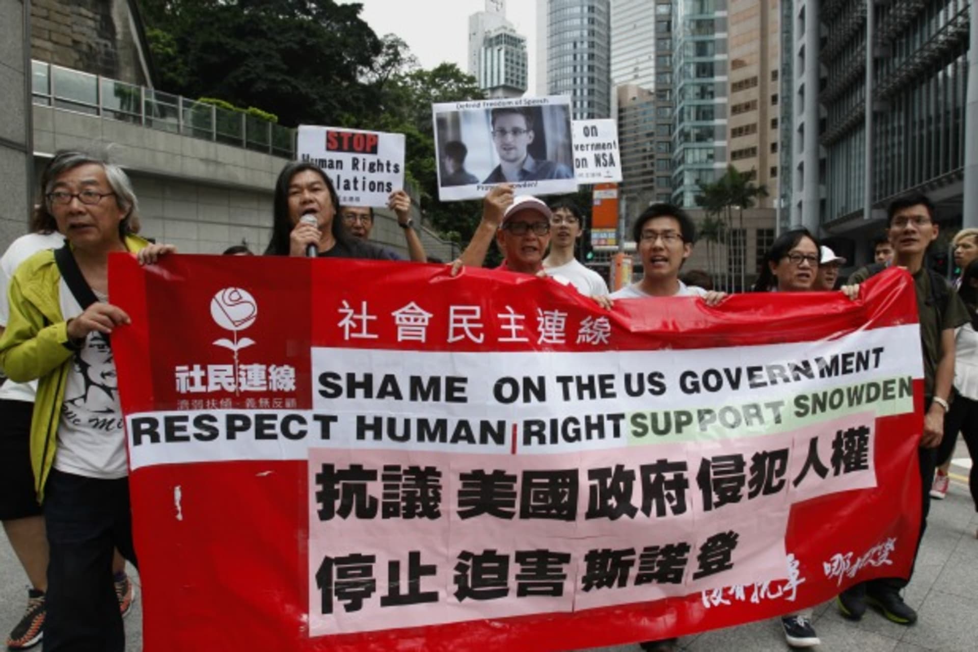 <p>Protesters supporting Edward Snowden, a contractor at the National Security Agency (NSA), chant slogans as they march to the U.S. Consulate in Hong Kong on June 13, 2013. (Bobby Yip/Courtesy Reuters)</p>
