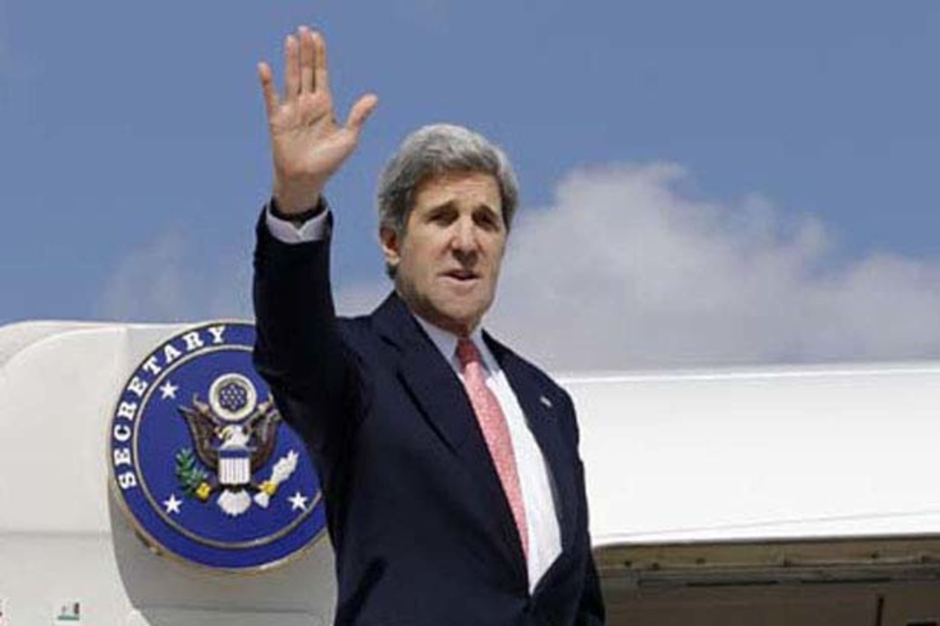 U.S. Secretary of State John Kerry waves as he leaves Ankara