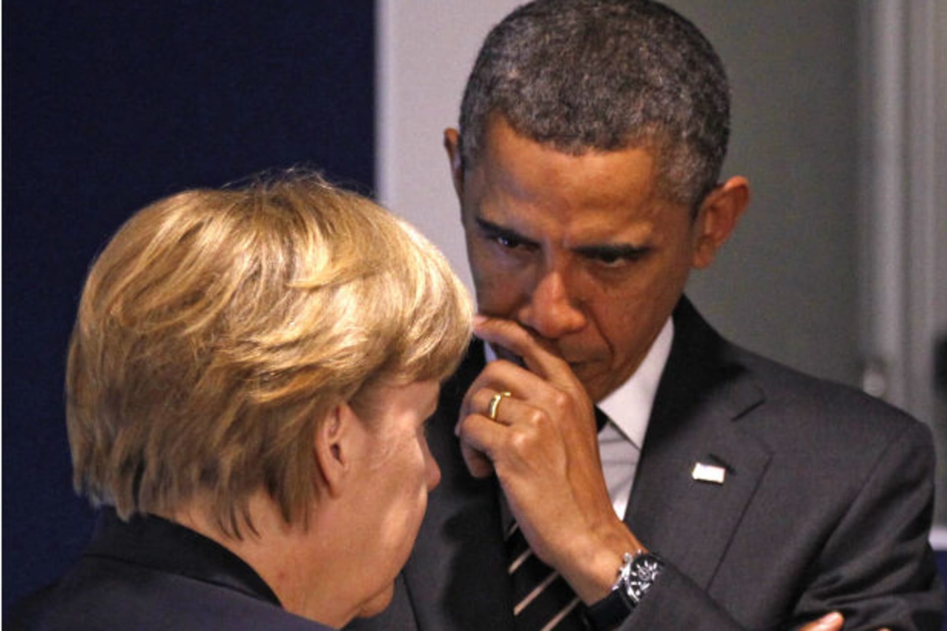 Germany's Chancellor Merkel and U.S. President Obama discuss before a meeting on the second day of the G20 Summit in Cannes