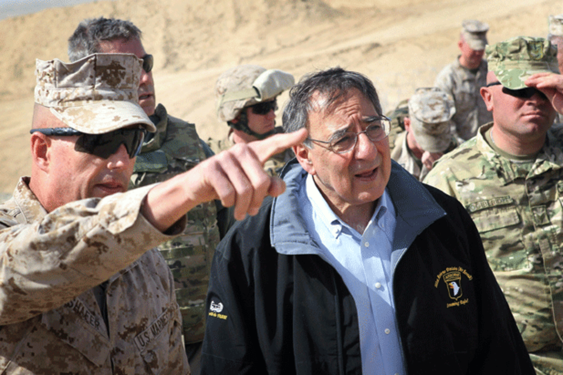 <p>Defense Secretary Leon Panetta is greeted by Col. John Shafer (L) after arriving to greet troops at Forward Operating Base Shukvani, Afghanistan on March 14, 2012. (Scott Olson/Courtesy Reuters)</p>
