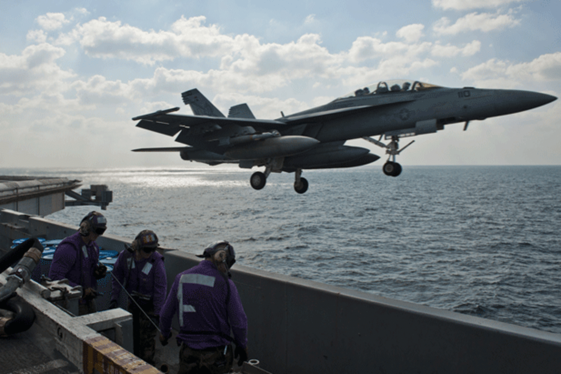 <p>An F/A-18F fighter jet launches off the aircraft carrier USS John C. Stennis during maneuvers in the Arabian Gulf. (Benjamin Crossley/courtesy Reuters)</p>
