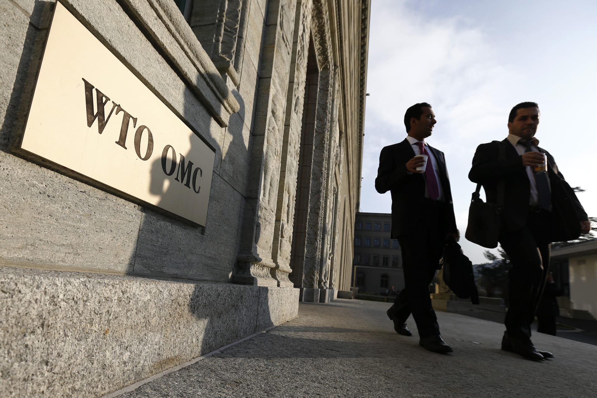 <p>Delegates arrive for a special meeting of the General Council Preparatory Committee on Trade Facilitation at the World Trade Organization (WTO) headquarters in Geneva.</p>
