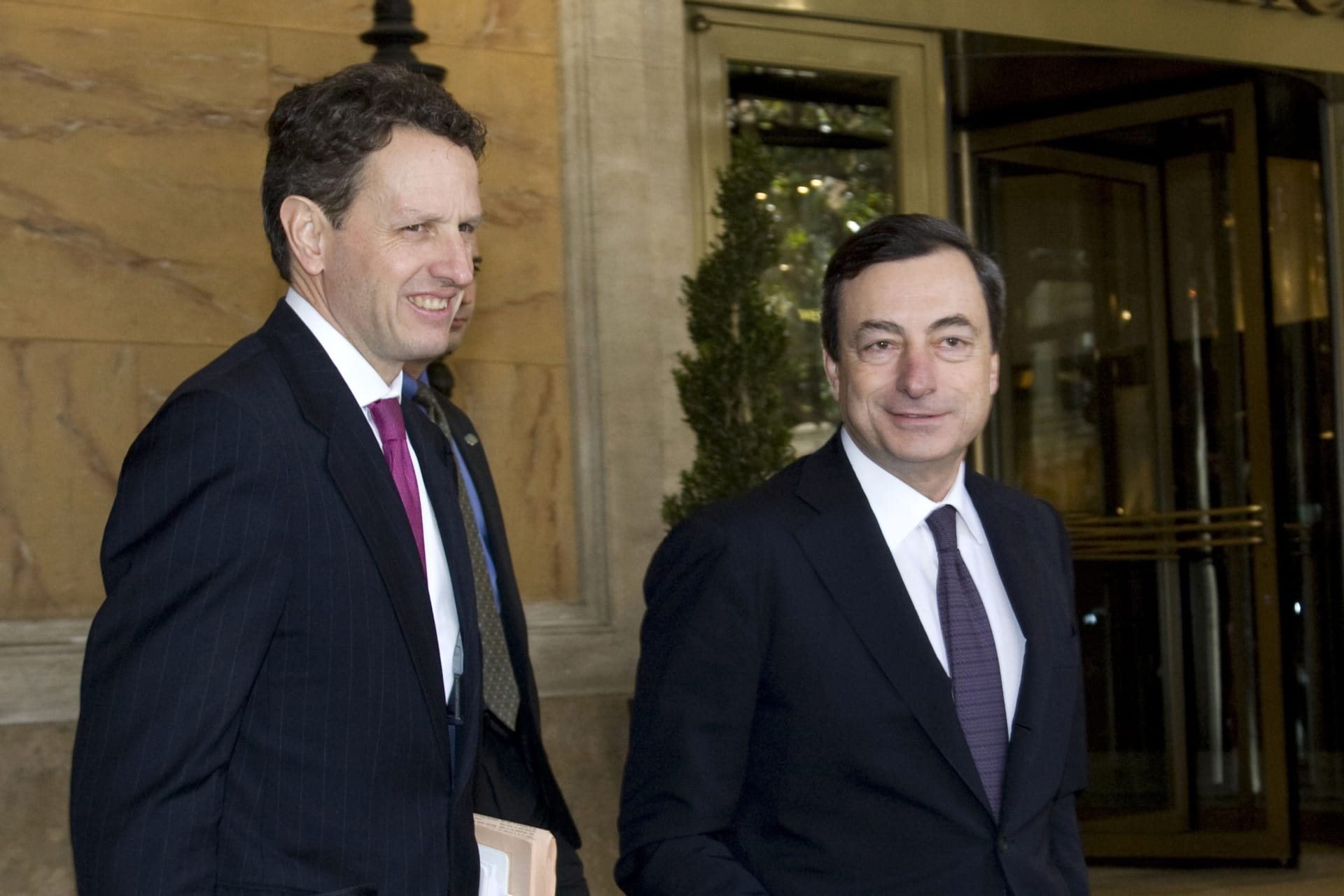 <p>U.S. Secretary of Treasury Timothy Geithner (L) and Bank of Italy Governor Mario Draghi leave a hotel in central Rome on February 13, 2009.</p>
