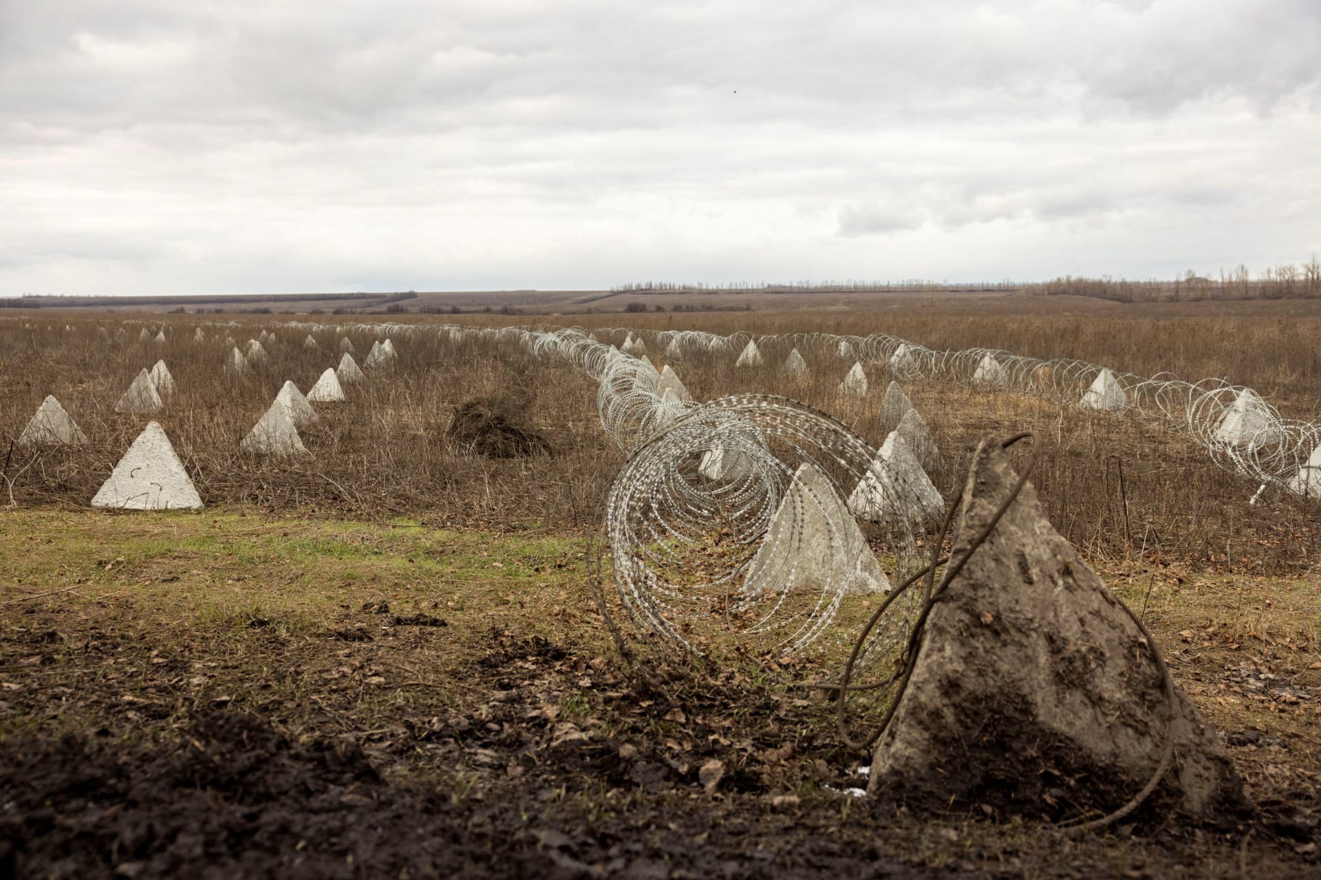 <p>Fortifications built by the Ukrainian army stretch across a field near the front line outside Kupiansk, Ukraine.</p>
