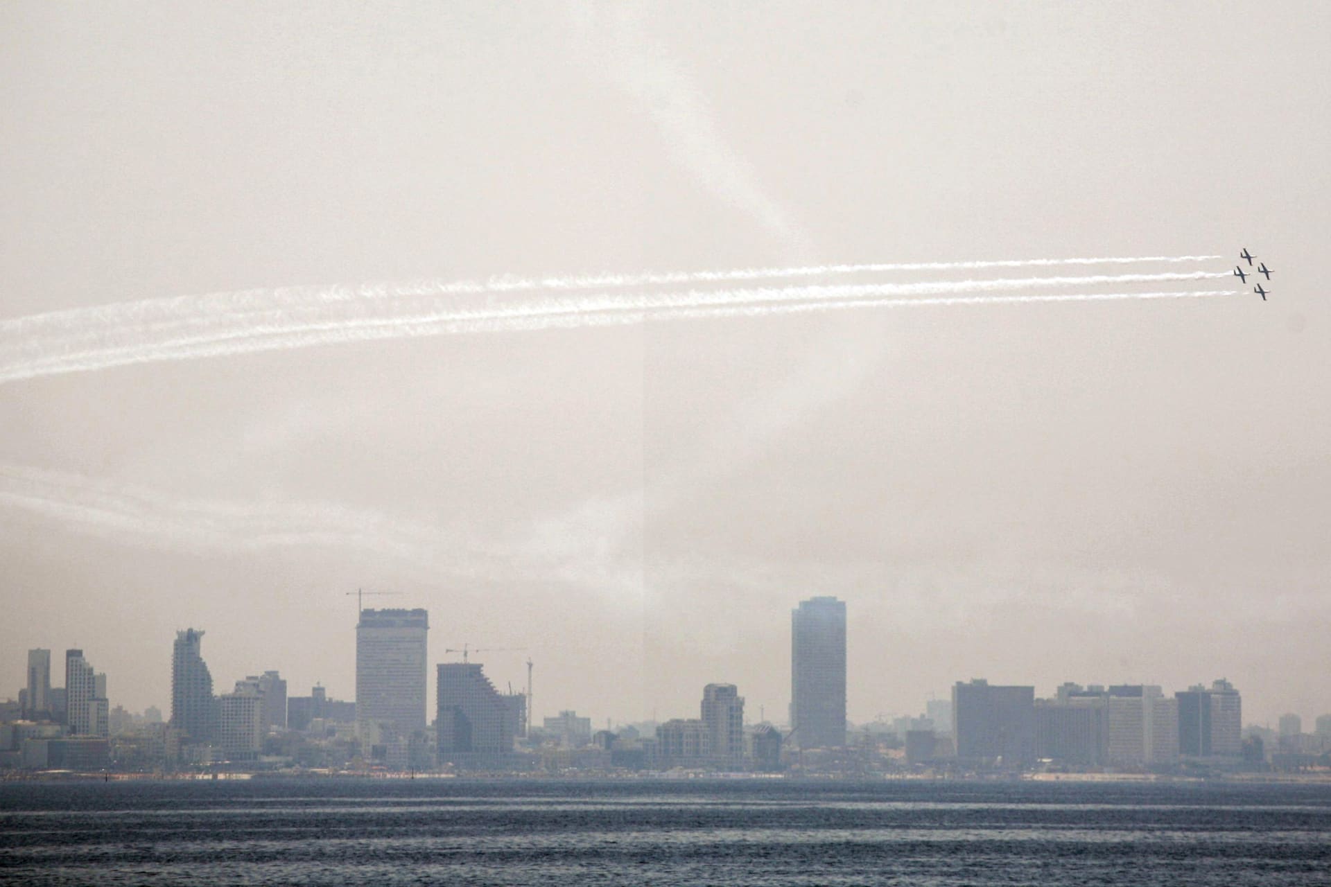 <p>Israel Air Force jets fly in formation off the coast of Tel Aviv as they practice for an aerobatics display, expected to take place later this week as part of celebrations for the 60th anniversary of Israel’s founding on May 5, 2008.</p>