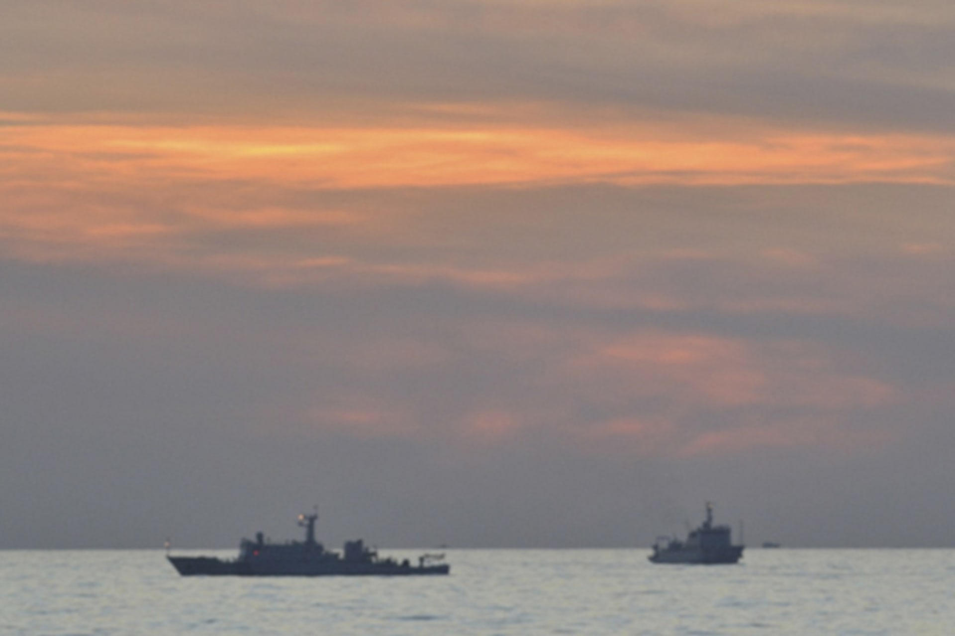 <p>A handout photo shows two Chinese surveillance ships which sailed between a Philippines warship and eight Chinese fishing boats to prevent the arrest of any fishermen in the Scarborough Shoal on April 10, 2012.</p>
