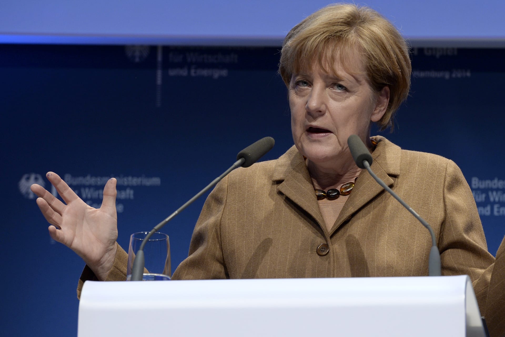 <p>German Chancellor Angela Merkel  delivers her speech at the “National IT Summit” at the chamber of commerce in Hamburg on October 21, 2014.</p>
