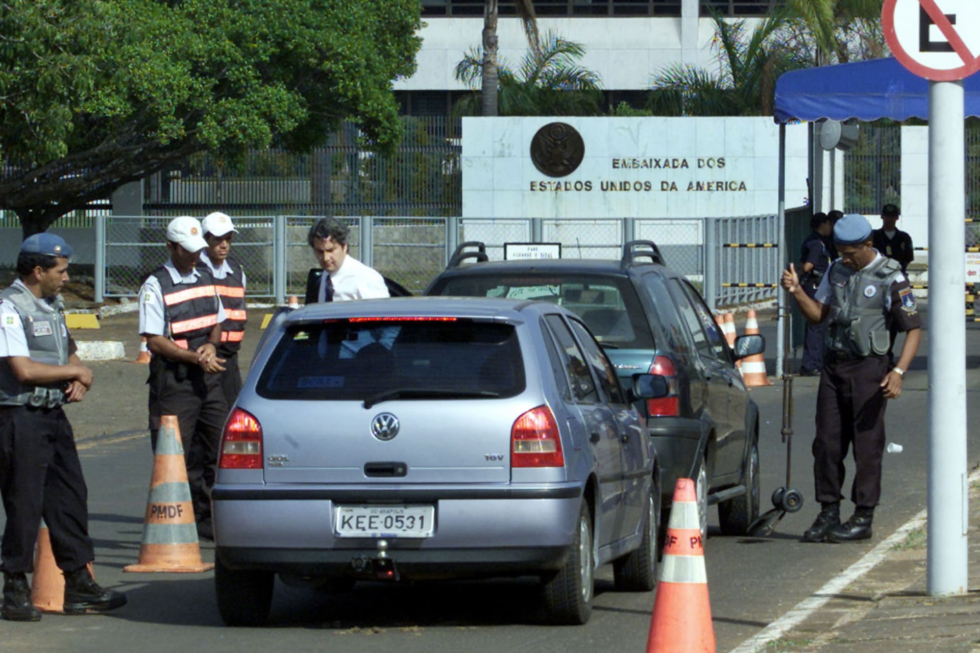 <p>Security officers examine vehicles prior to entering the grounds of the U.S. Embassy in Brasilia on September 11, 2003.</p>