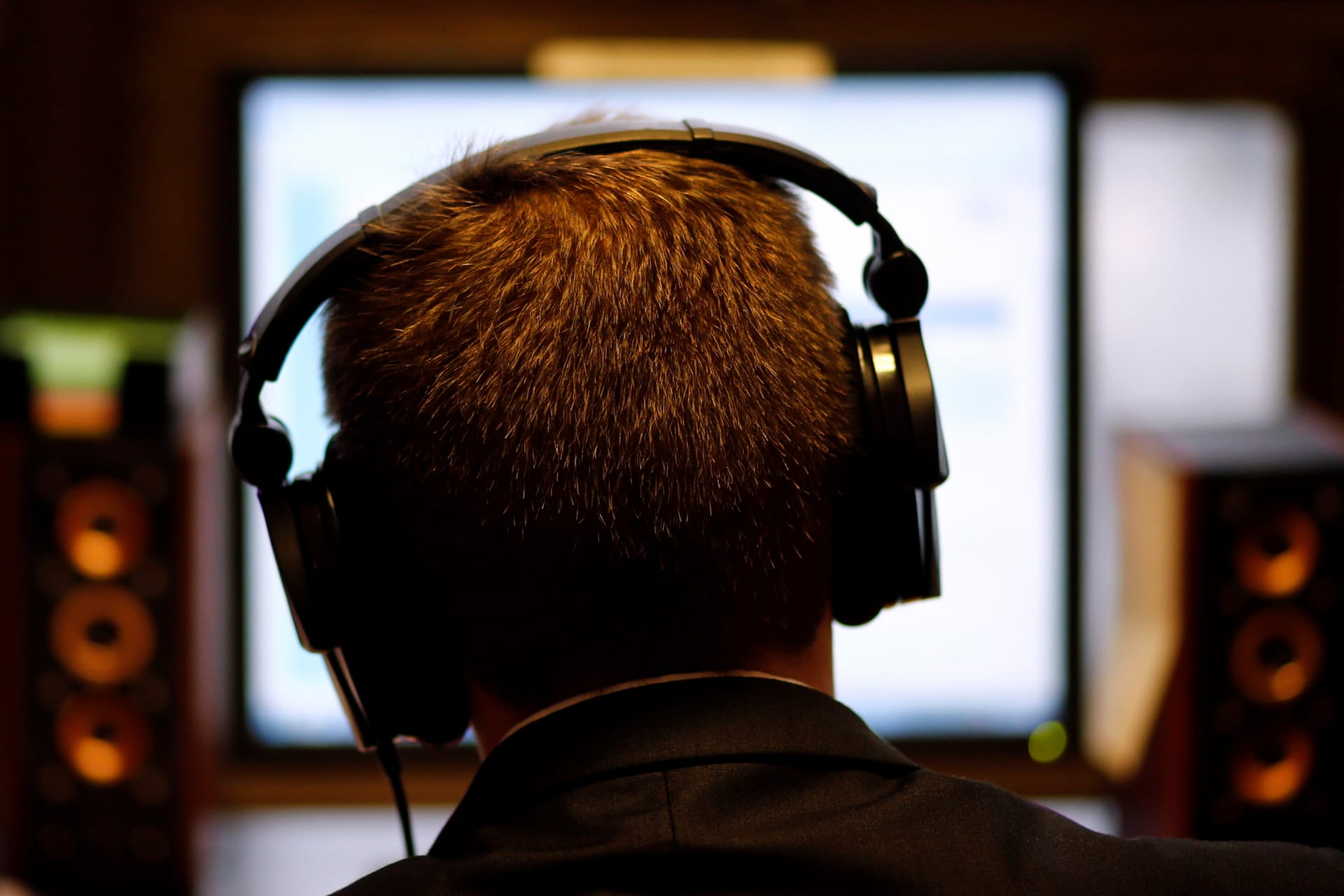 <p>A man uses headphones while working at the Justice Ministry’s agency for communications capturing in Buenos Aires, Argentina, on July 14, 2016. </p>
