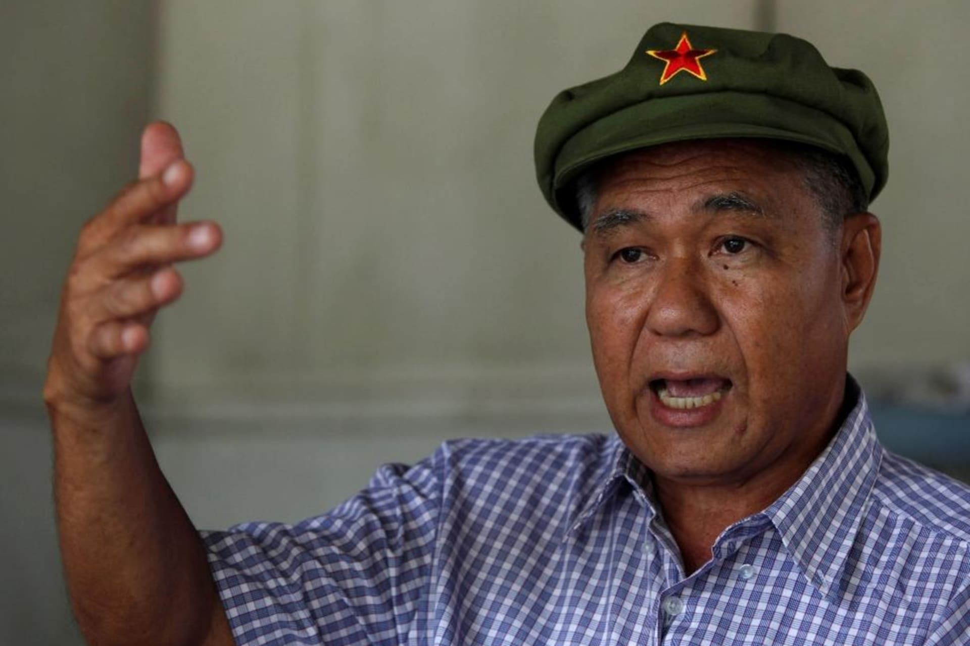 <p>Surachai Danwattananusorn, a critic of the Thai monarchy, gestures during an interview in Bangkok on August 25, 2010. Shortly after two of his aides were found dead in the Mekong River, Surachai disappeared in 2019.</p>
