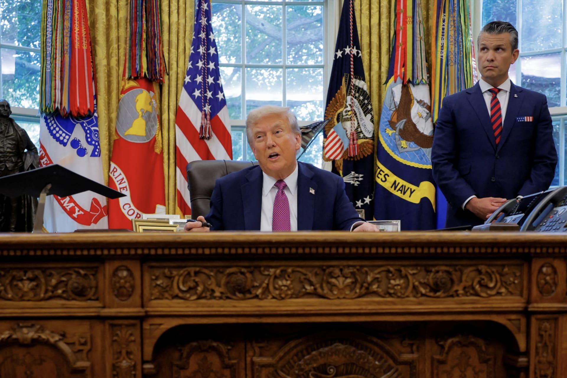 <p>U.S. President Donald Trump, accompanied by U.S. Defense Secretary Pete Hegseth, speaks with the media while signing an executive order in the Oval Office, at the White House in Washington, D.C., on September 5.</p>
