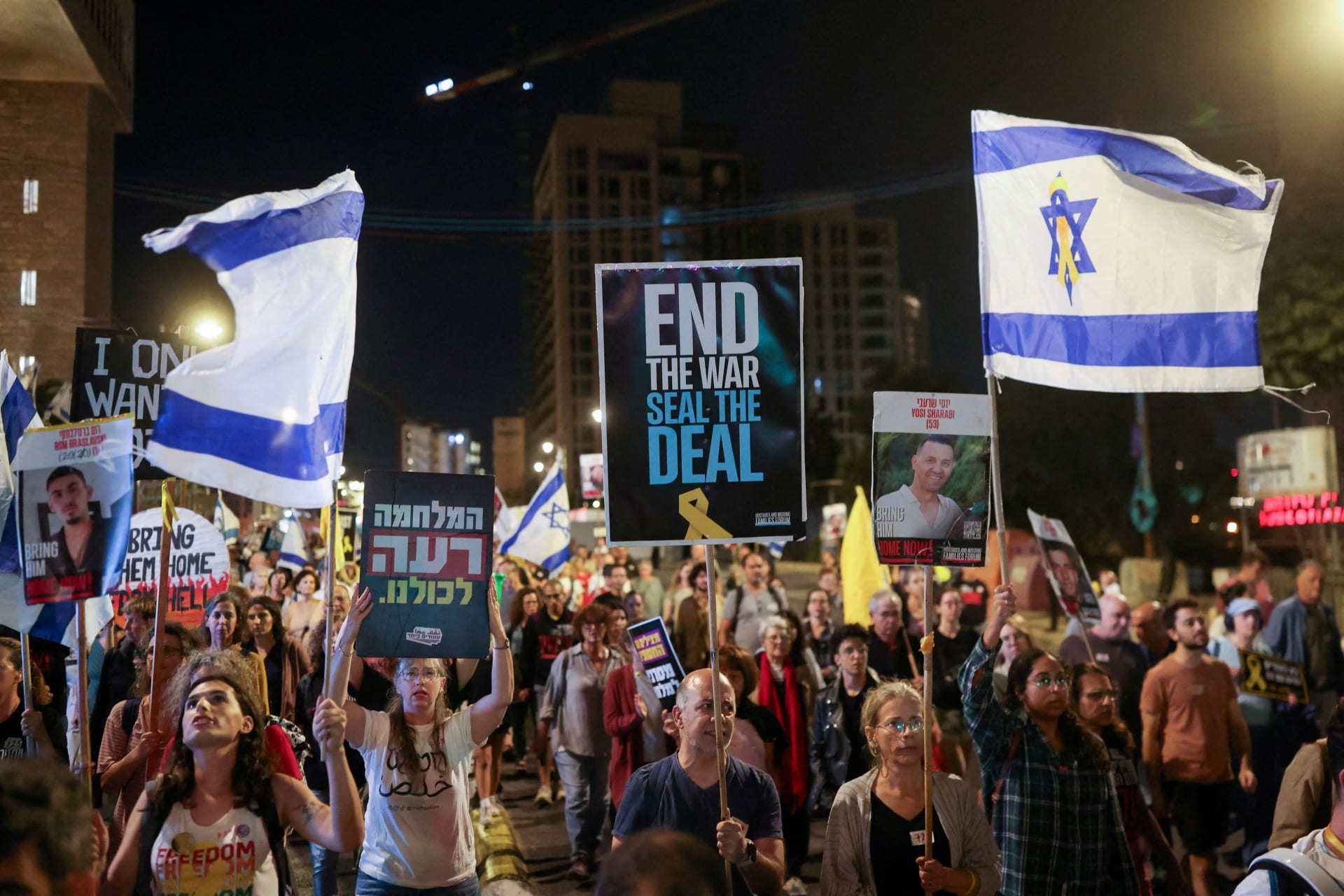 <p>Protesters carry flags and placards in support ahead of the two-year anniversary of the deadly October 7, 2023, attack on Israel by Hamas, demanding the immediate release of all hostages and the end of the war in Gaza, in Jerusalem on October 4.</p>
