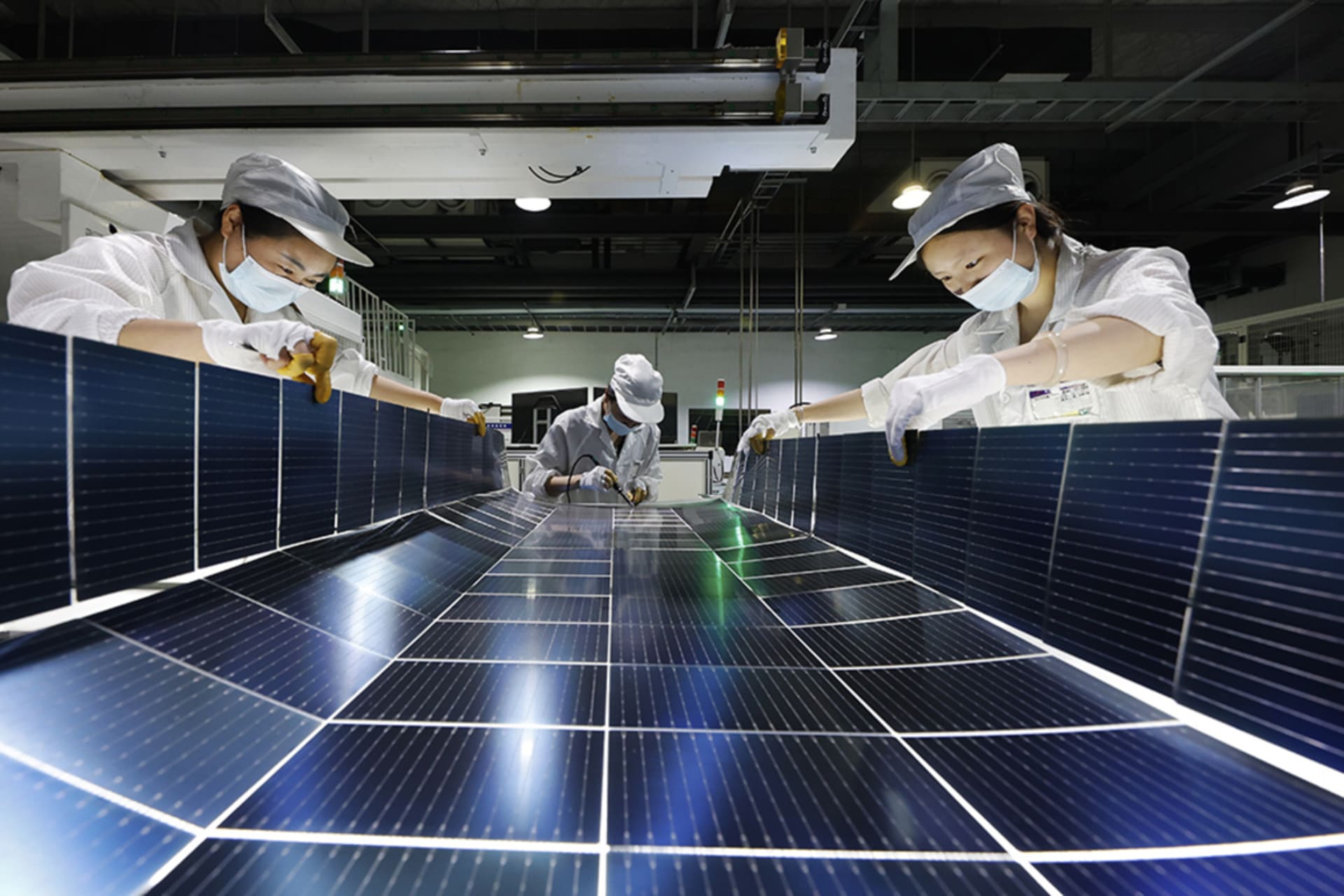 <p>Employees work on the production line of solar panels at a workshop of Jiangsu DMEGC New Energy Co., Ltd. on July 22, 2025 in Suqian, Jiangsu Province of China.</p>
