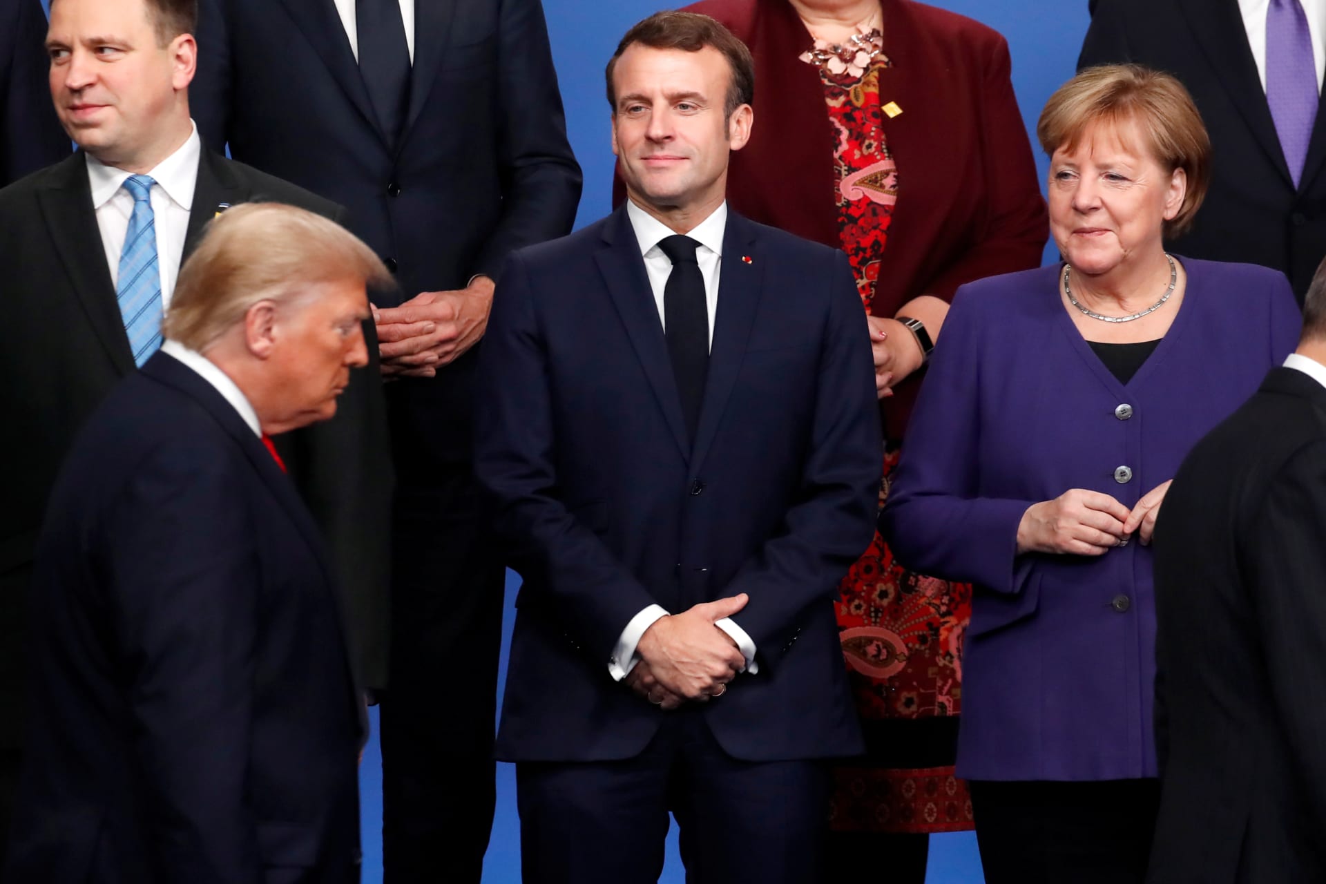 <p>French President Emmanuel Macron and German Chancellor Angela Merkel look on as U.S. President Donald J. Trump and Turkish President Recep Tayyip Erdogan walk at the NATO leaders summit in Watford, United Kingdom, on December 4, 2019. </p>
