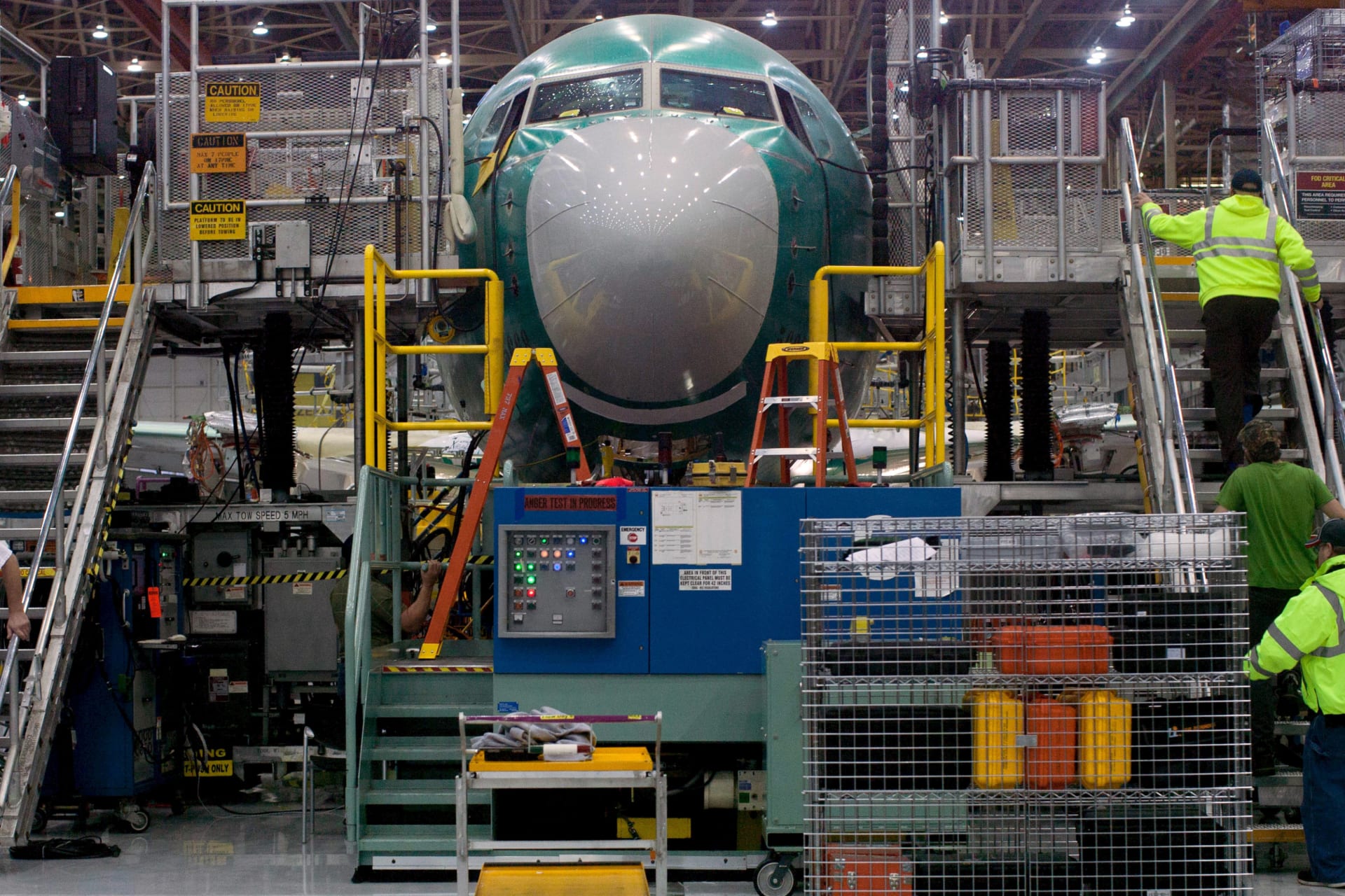 <p>Boeing employees march up and down stairs entering and exiting Boeing 737 MAX during a media tour of the Boeing 737 MAX at the Boeing plant in Renton, Washington December 7, 2015.</p>
