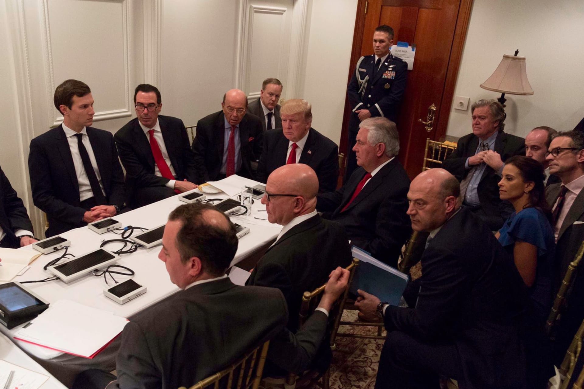 <p>U.S. President Donald Trump meeting with his National Security team after a missile strike on Syria while inside the Sensitive Compartmented Information Facility at his Mar-a-Lago resort in West Palm Beach, Florida, on April 6, 2017.</p>
