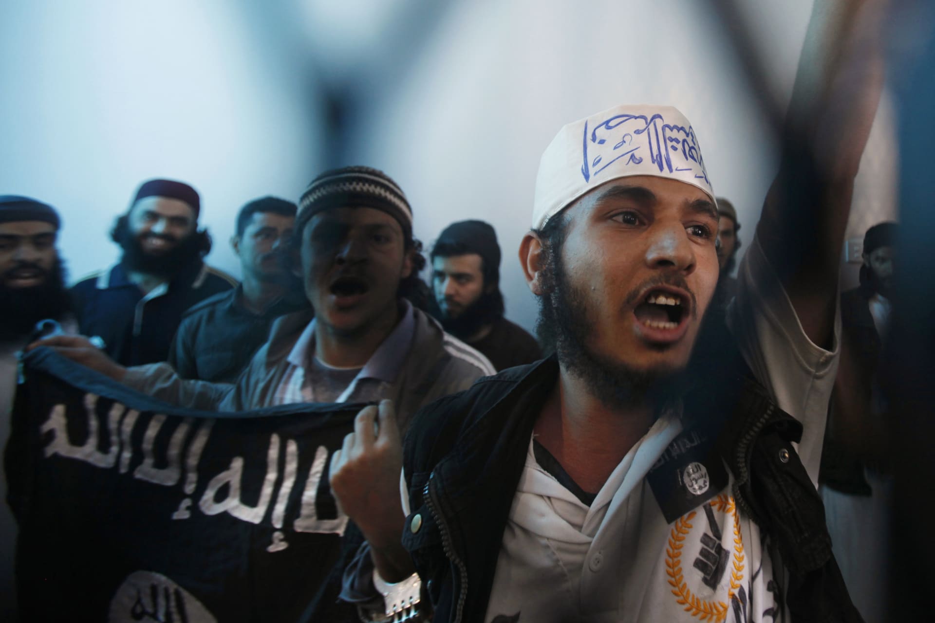 <p>Defendants linked to al Qaeda react as a verdict upholding their jail sentences are pronounced at a state security court of appeals, in Sanaa on April 23, 2013.</p>
