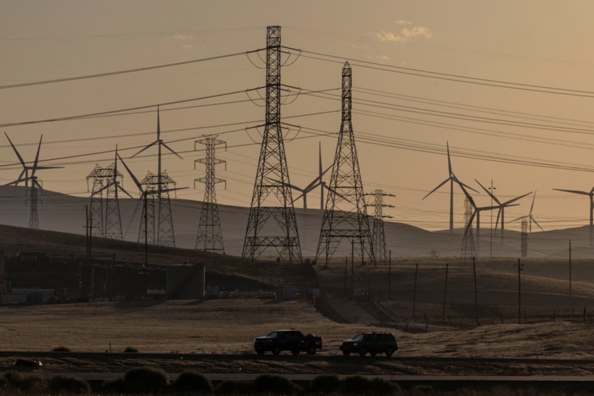 <p>A view of windmills and power lines.</p>
