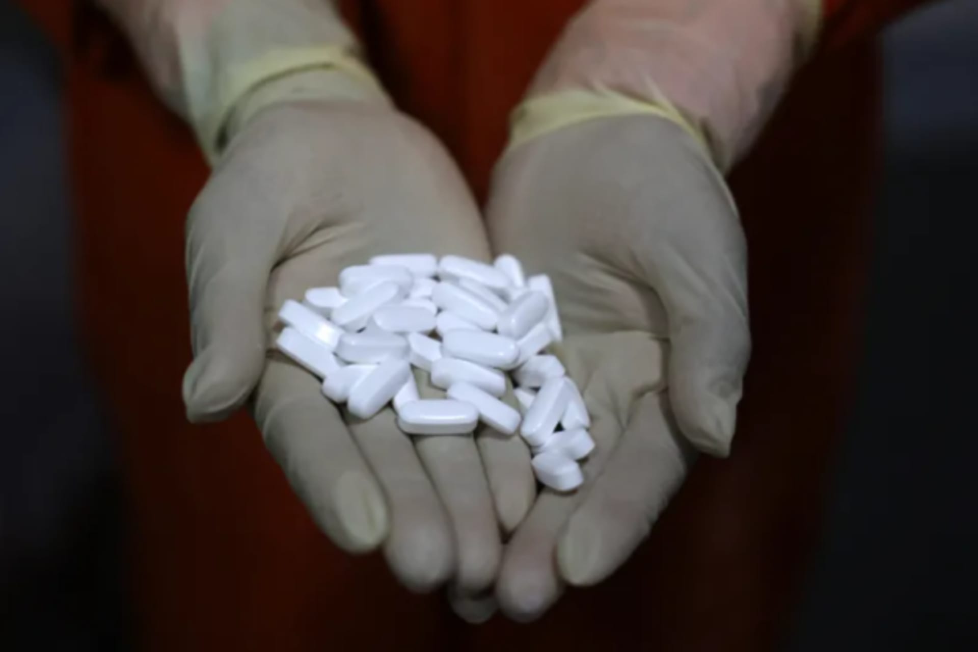 <p>An employee checks coated tablets at a manufacturing plant in Ahmedabad, India, April 2025</p>
