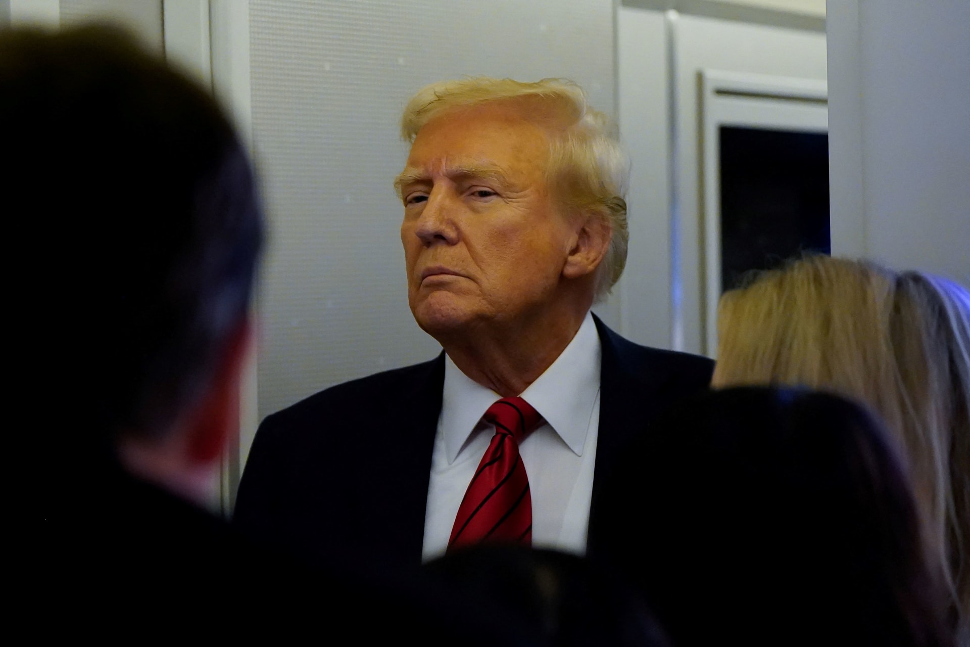 Photo of President Donald Trump speaking to reporters aboard Air Force One