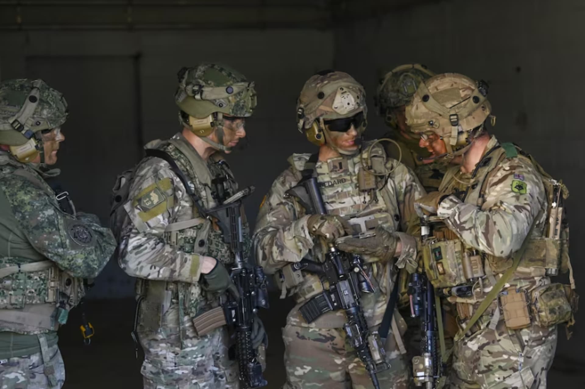 <p>Members of the U.S. Army’s Experimental Force and a British infantry platoon take part in a simulated town clearing during the Army Expeditionary Warrior Experiment 23 on March 16 at Fort Benning, Ga. </p>
