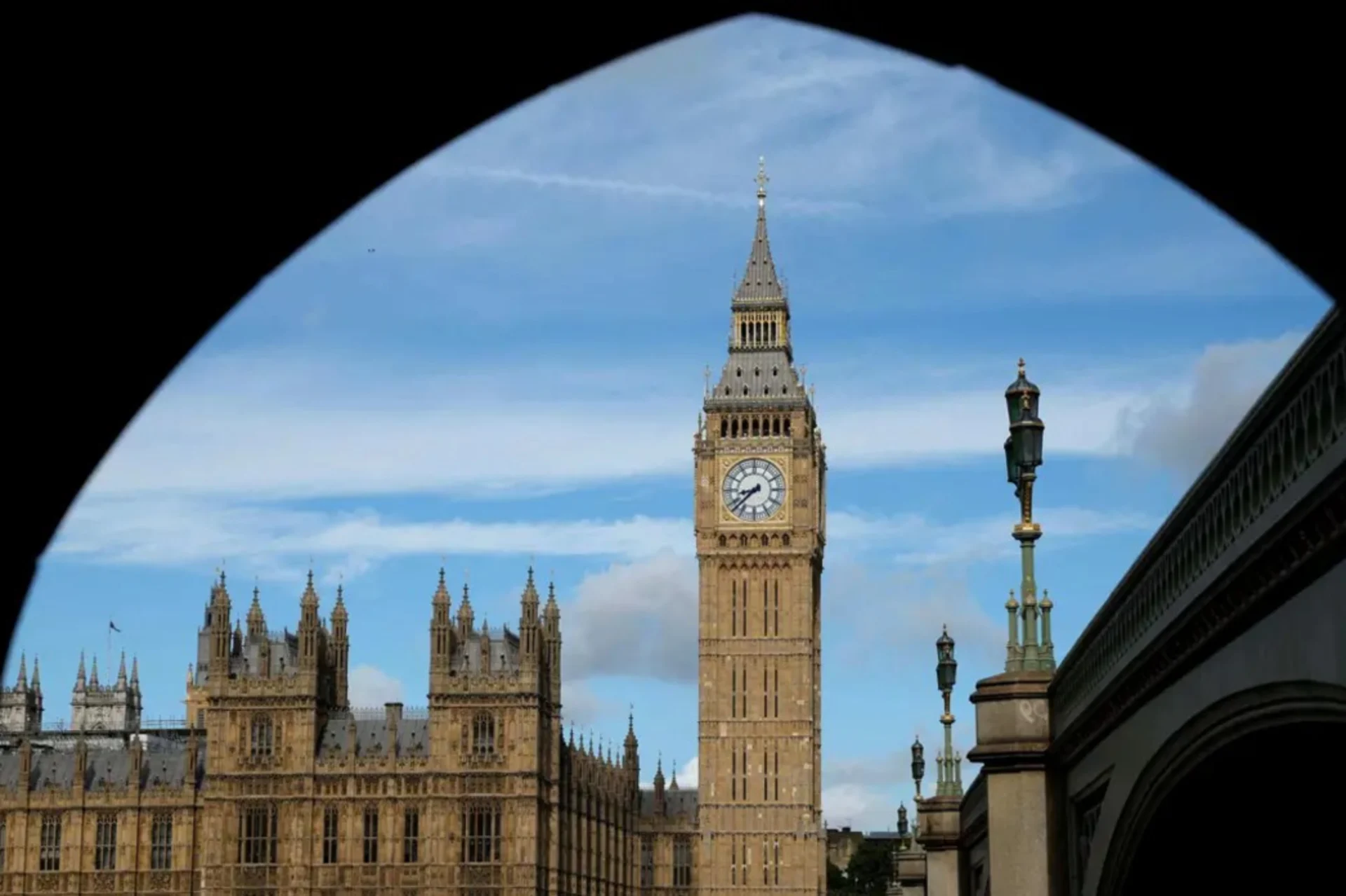 Photo of Big Ben viewed through an arch.