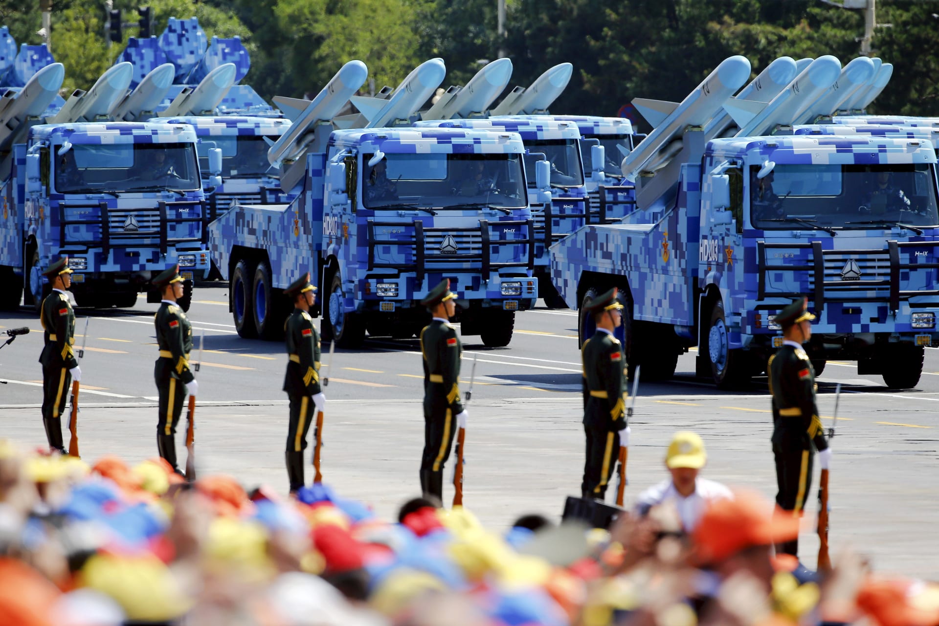 <p>China’s People’s Liberation Army (PLA) navy soldiers on their armored vehicles carrying ship-to-air missiles roll to Tiananmen Square during the military parade marking the 70th anniversary of the end of World War II, in Beijing, China, September 3, 2015.</p>
