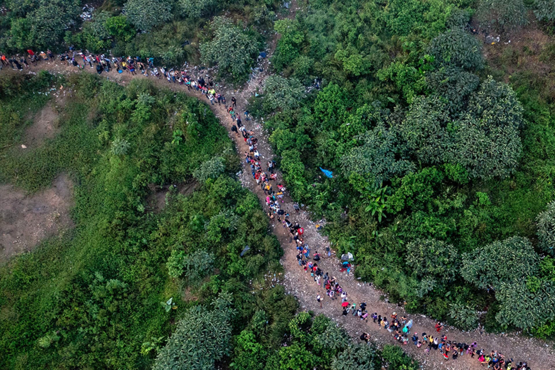 <p>Aerial view showing migrants walking through the jungle near Bajo Chiquito village, the first border control of the Darién Province in Panama, September 22, 2023.</p>
