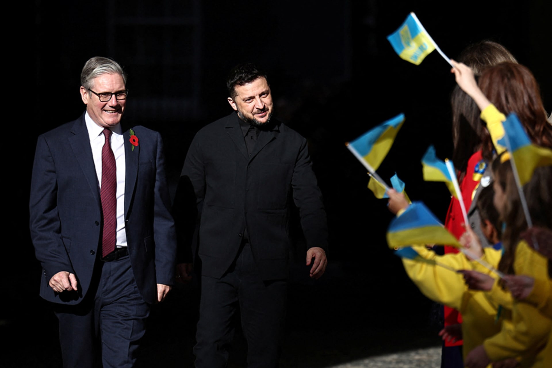 <p>British Prime Minister Keir Starmer and Ukrainian President Zelenskyy are greeted by Ukranian school children as they arrive for a meeting of the Coalition of the Willing, in London, Britain, October 24, 2025.</p>