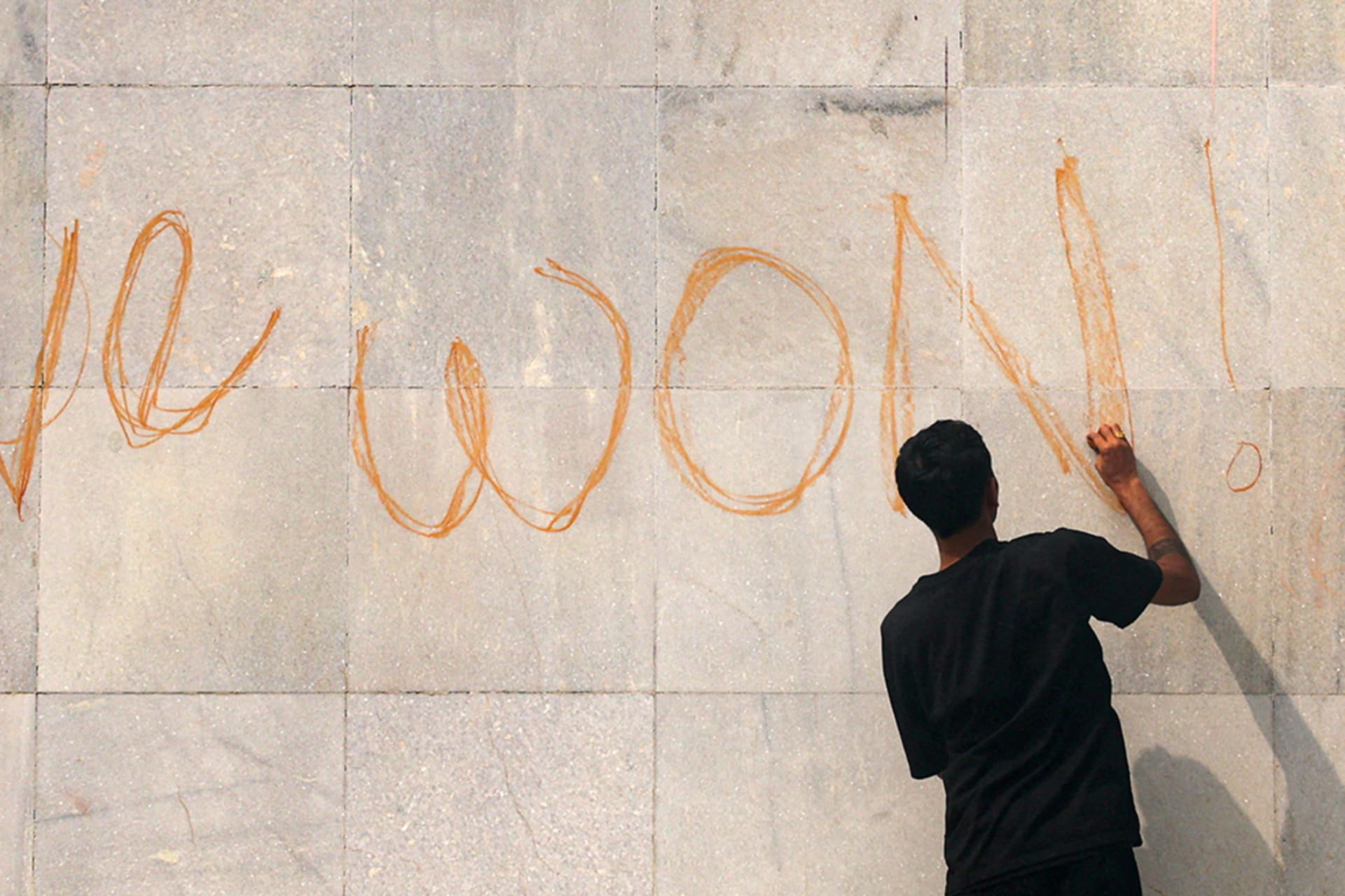 <p>A demonstrator writes on the parliament building during a protest in Kathmandu, Nepal, September 9, 2025.</p>
