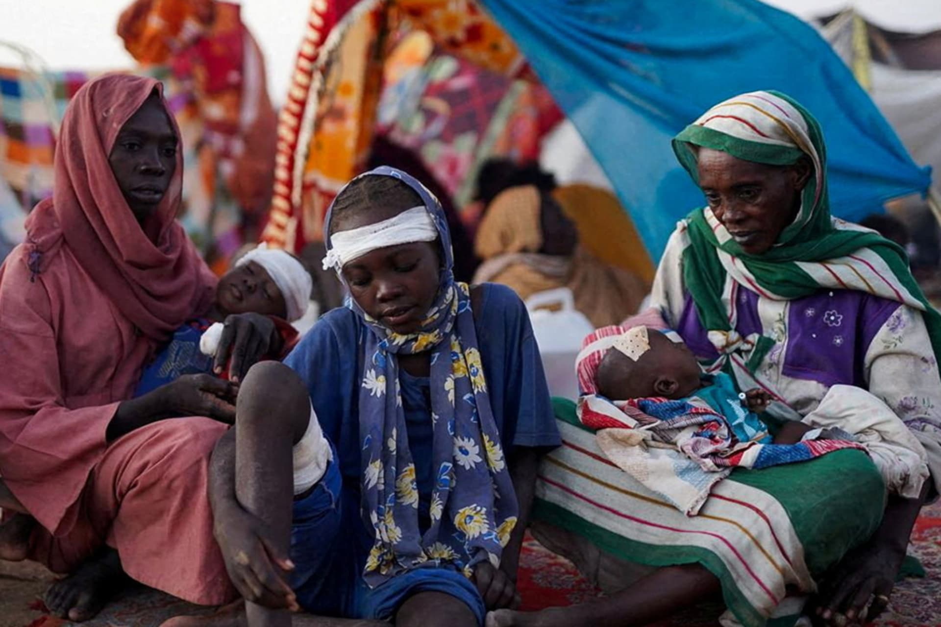 <p>The grandmother of Ikram Abdelhameed looks on next to her family while sitting at a camp for displaced people who fled from al-Fashir to Tawila, North Darfur, Sudan, October 27, 2025.</p>
