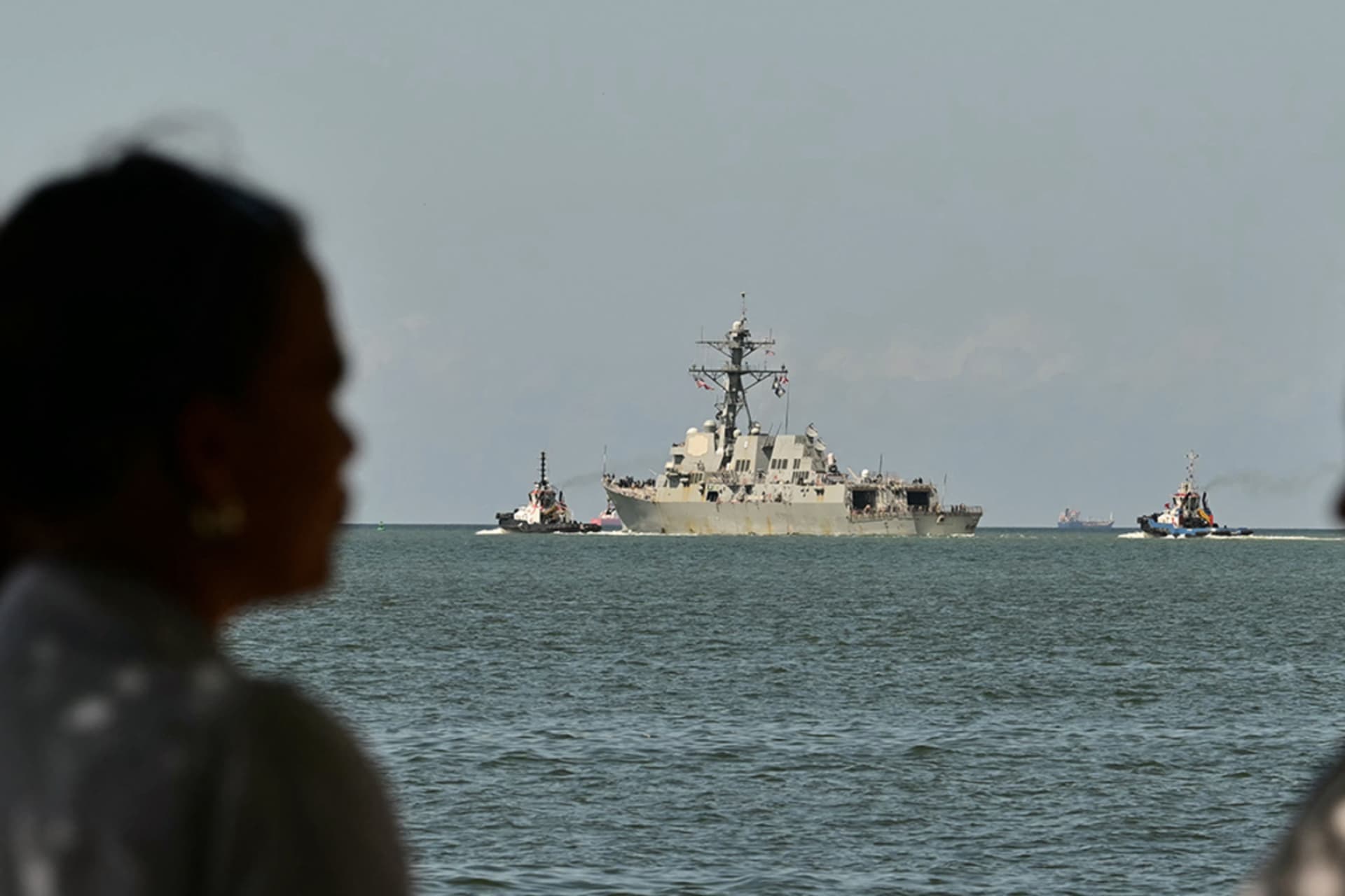 <p>People watch the USS Gravely, a U.S. Navy warship, departing the Port of Spain on October 30, 2025. </p>
