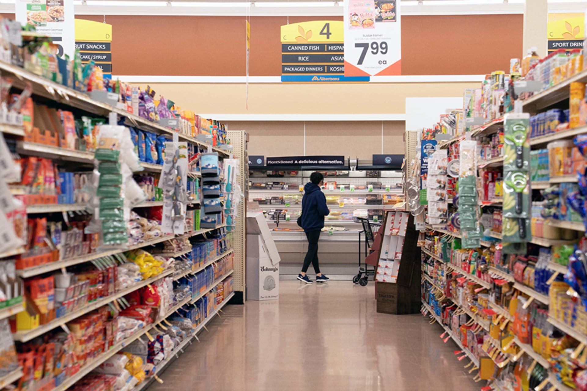 <p>A food shopper browses for groceries ahead of the Thanksgiving Day holiday at an Albertsons supermarket in Redmond, Washington, on November 24.</p>
