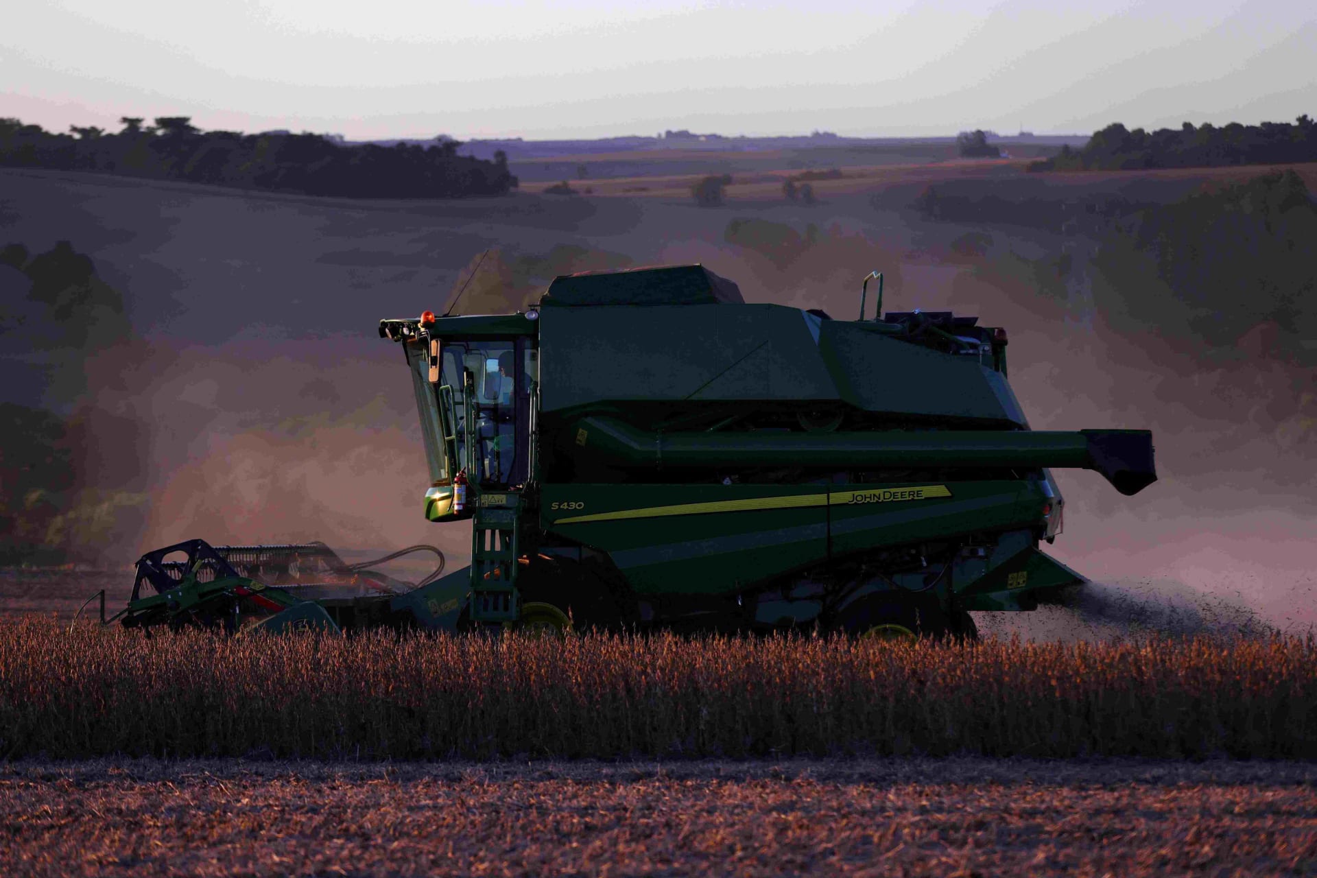 <p>A farm worker operates a combine harvester during the soybean harvest season in Brazil’s southernmost state, on a farm in Nao Me Toque, Rio Grande do Sul state, Brazil, April 4, 2025.</p>
