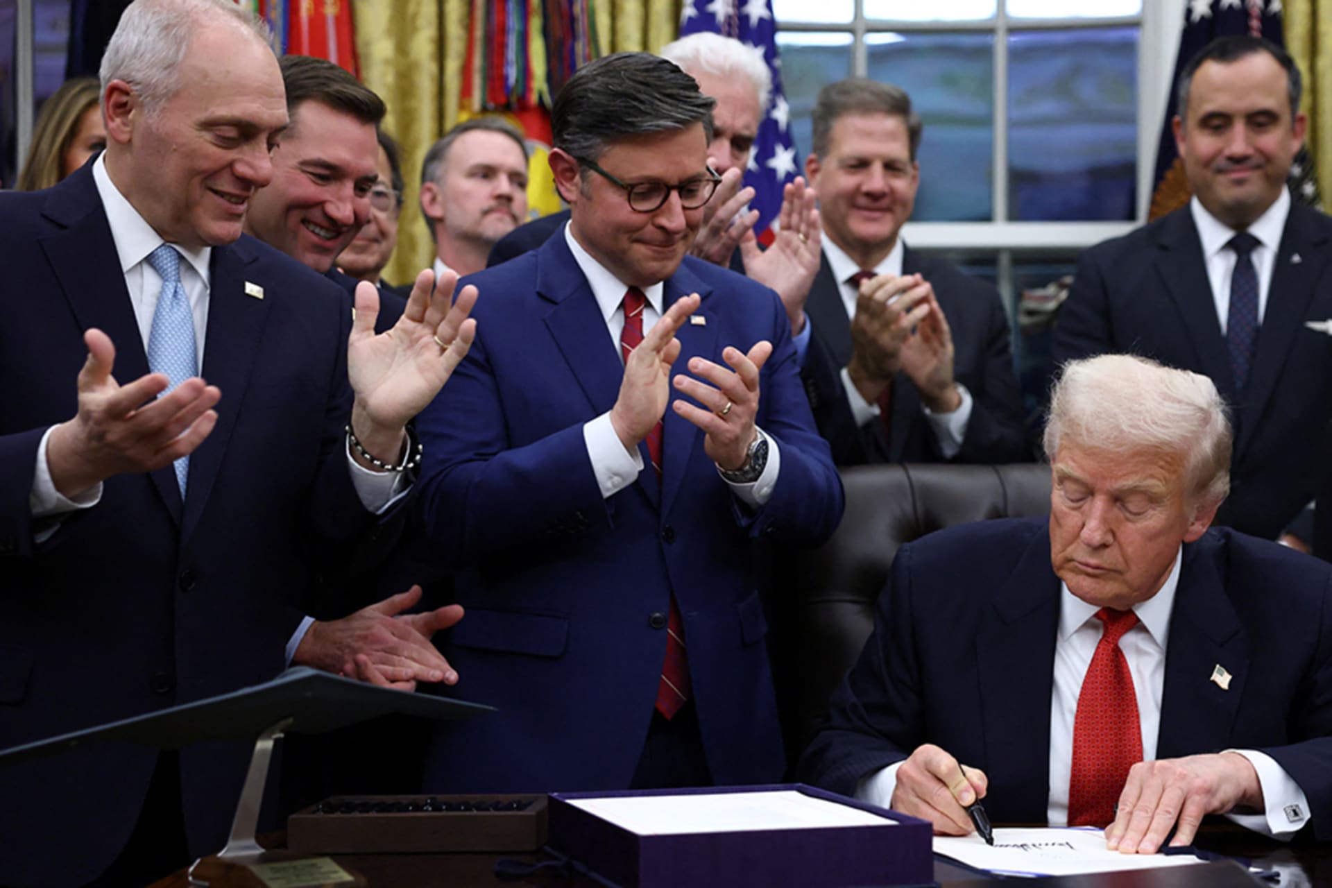 <p>U.S. President Donald Trump signs the funding bill to end the U.S. government shutdown, at the White House in Washington, D.C., U.S., November 12, 2025. </p>