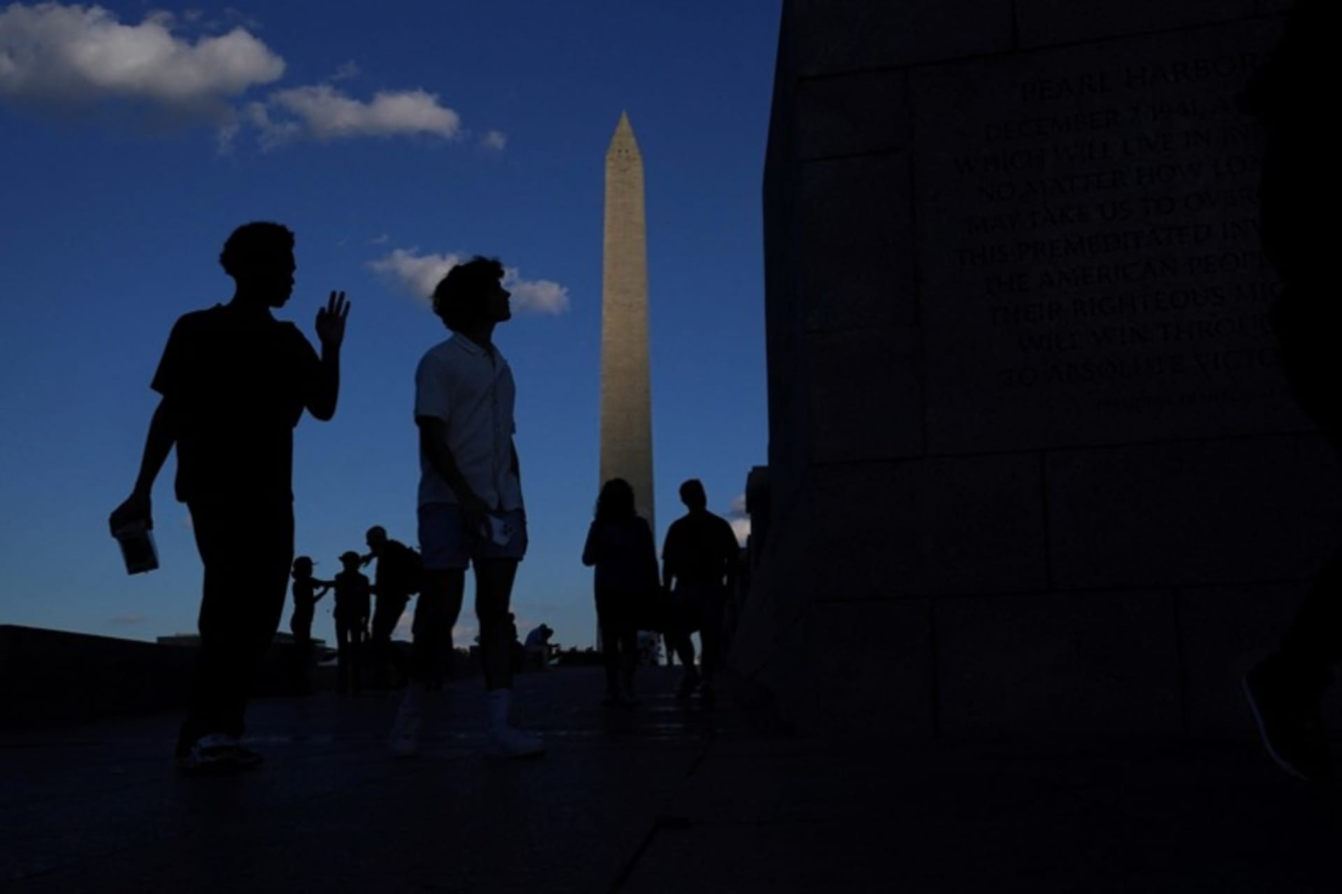 <p>Visitors walk past the Washington Monument in Washington, DC, on Veterans Day, November 11, 2024.</p>

