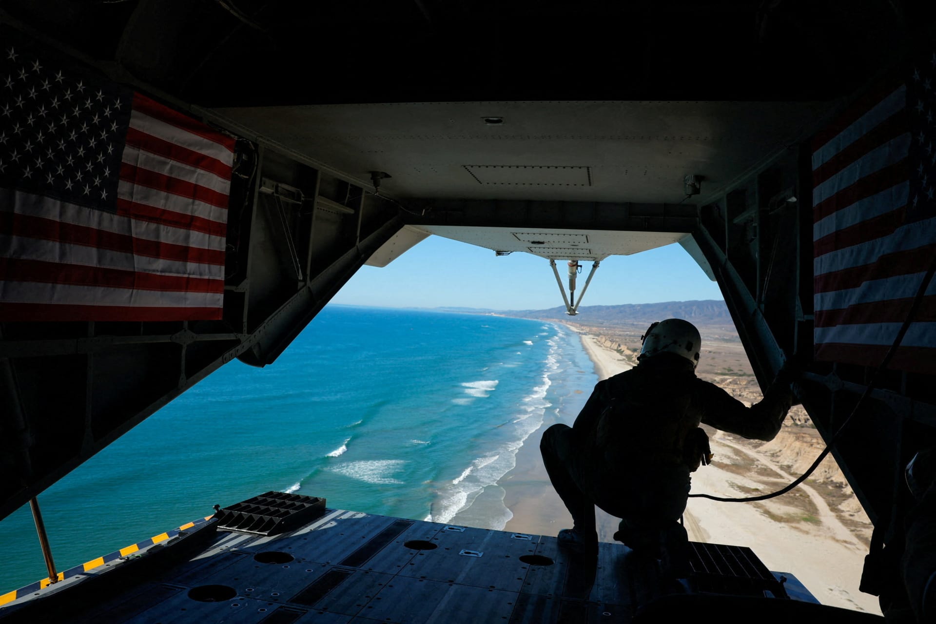 <p>A U.S. marine looks out over the Pacific coastline as U.S. Marines conduct an amphibious assault exercise at Camp Pendleton, California, October 18, 2025. </p>
