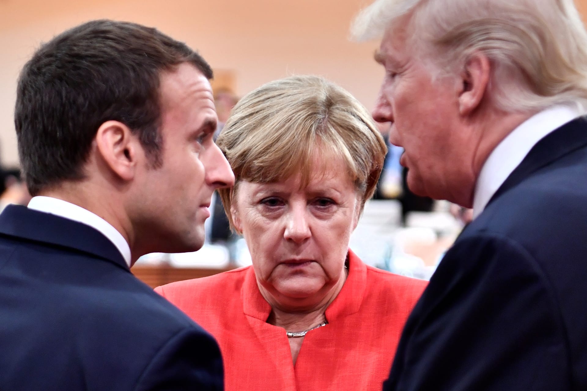 <p>French President Emmanuel Macron, German Chancellor Angela Merkel, and U.S. President Donald J. Trump confer at the Group of Twenty meeting in Hamburg, Germany, on July 7, 2017</p>
