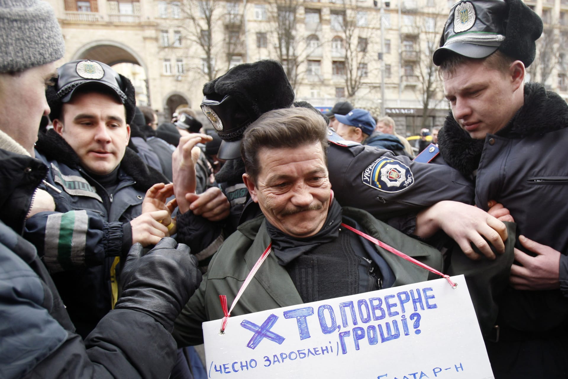 <p>A demonstrator clashes with police during a rally against Mayor Leonid Chernovetsky in front of Kiev’s city council office on March 26, 2009.</p>
