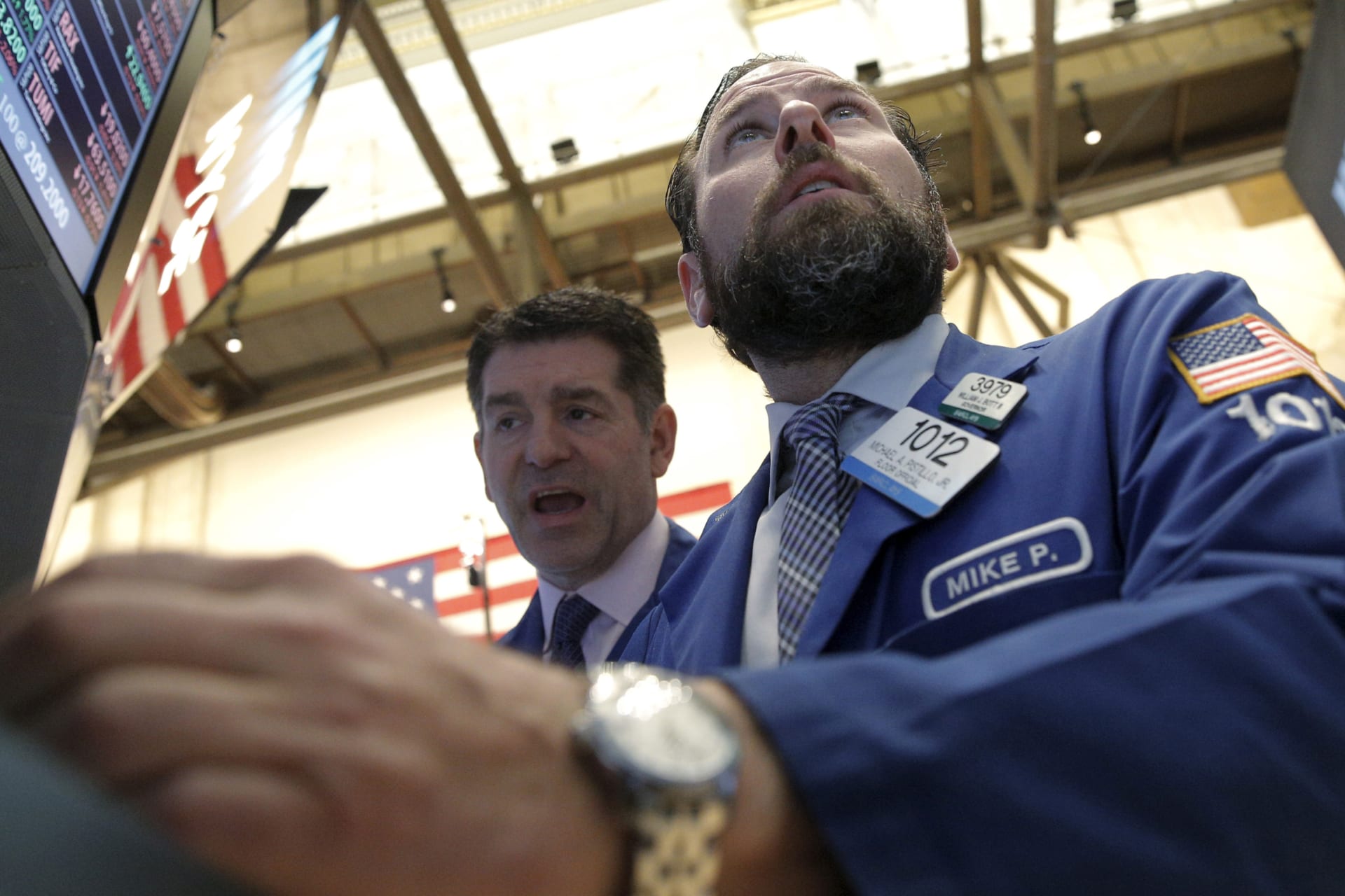 <p>Traders work on the floor of the New York Stock Exchange (NYSE) on February 24, 2016.</p>
