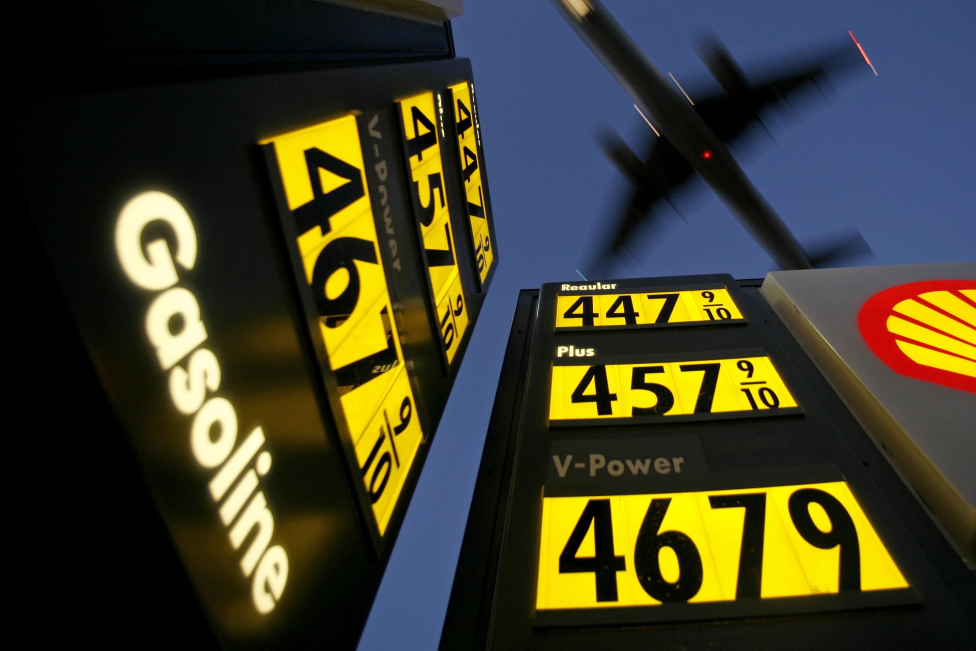 <p>Gasoline prices are advertised at a gas station near Lindbergh Field as a plane approaches to land in San Diego, California, on June 1, 2008.</p>
